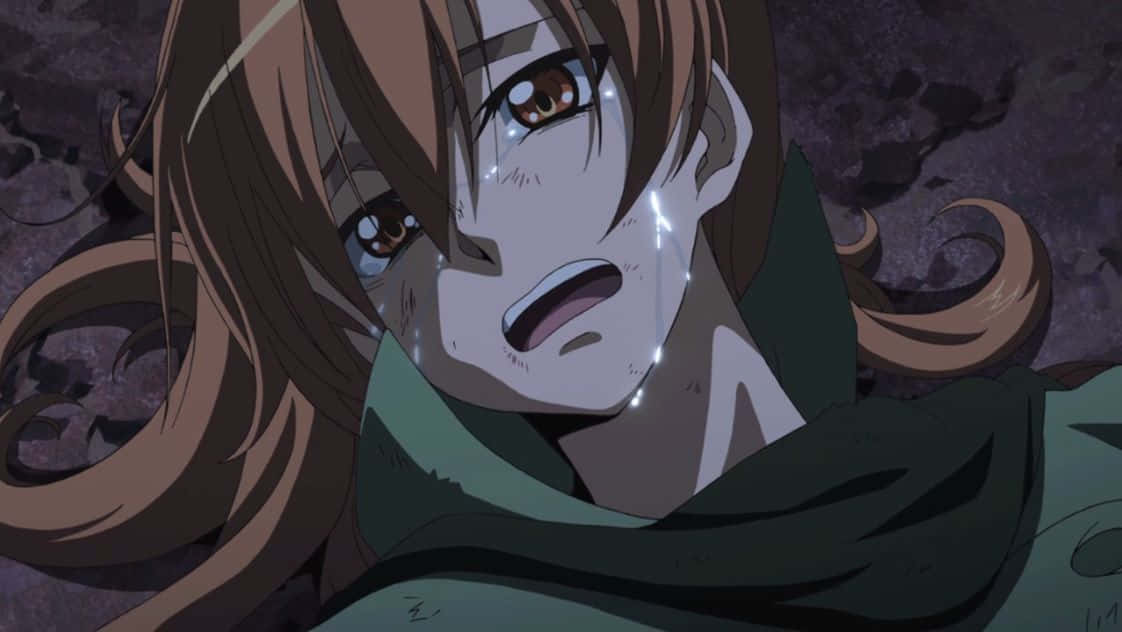 《殺戮的夜襲隊》角色瑟莉烏斯·烏比奎托斯哭泣畫面 壁紙 — 一個棕色頭髮、臉上帶淚痕的動漫女孩特寫，在黑暗岩石背景下震驚地抬頭看。