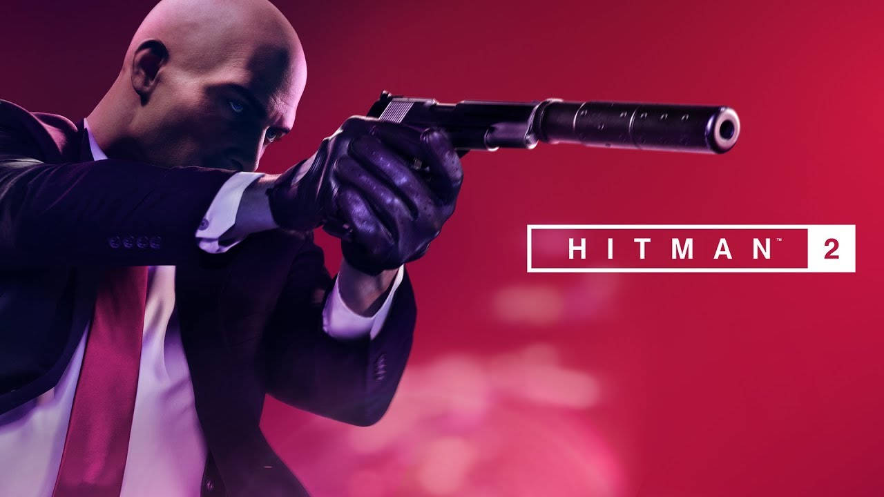 Hitman 2刺客在紅色背景上瞄準消音手槍