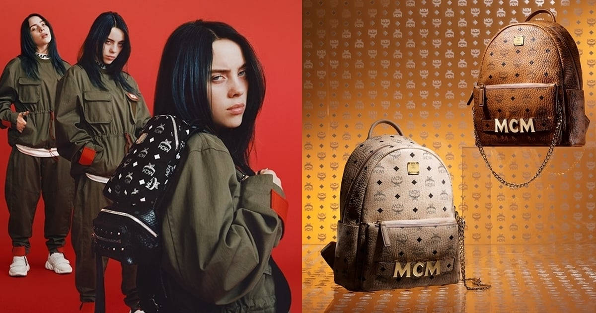 Billie Eilish 身穿橄欖綠色服裝，與 MCM 背包在金色圖案背景上。