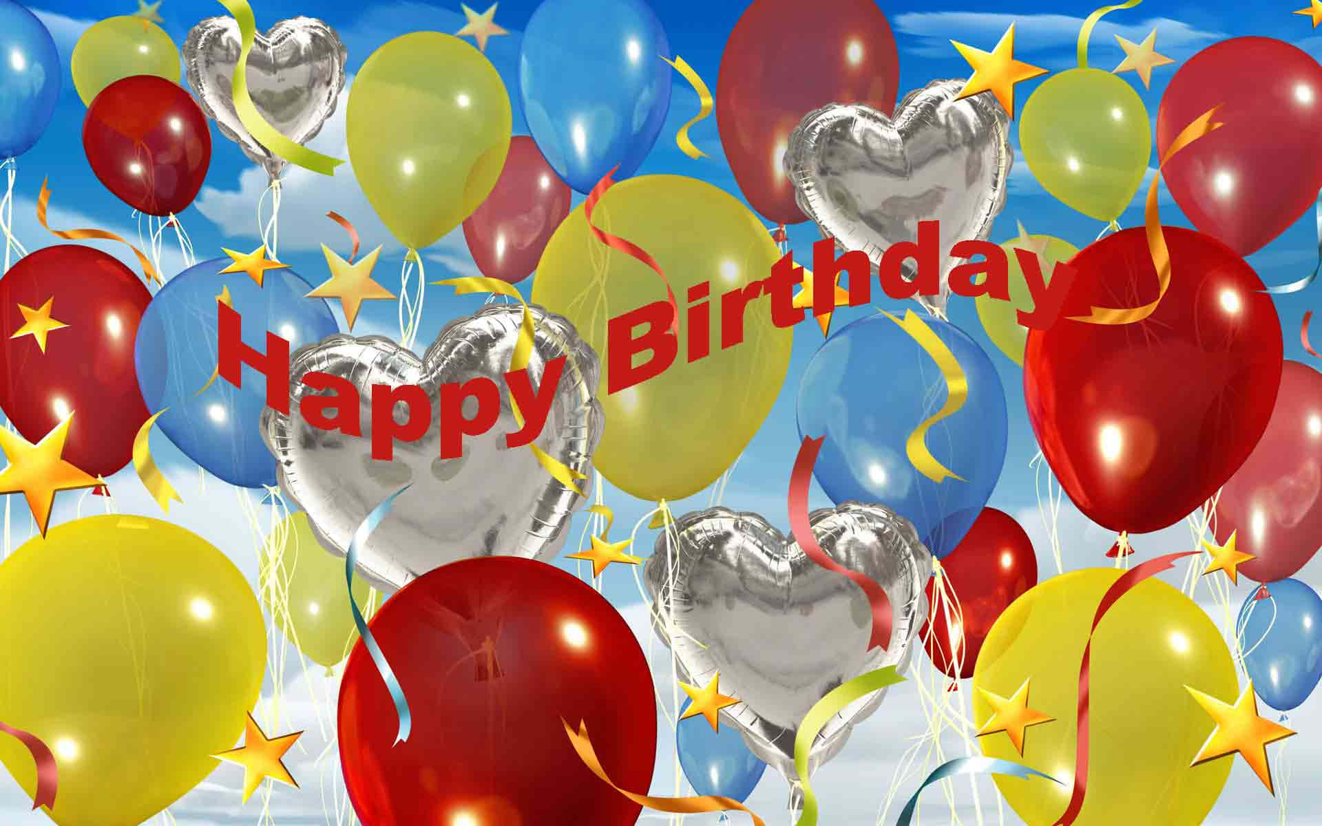 氣球紙屑生日快樂橫幅圖片 壁紙 — 鮮豔的紅色、黃色和藍色氣球，帶有銀色心形和星星，在明亮的藍天中飄浮，並有「Happy Birthday」文字。
