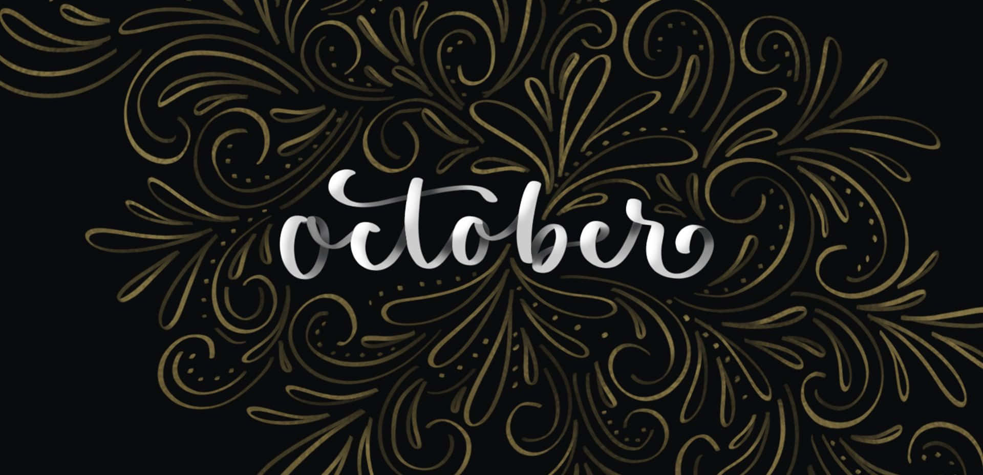沉醉十月，秋葉與晴空共舞 壁紙 — 優雅的銀色字體拼寫出october，周圍環繞著精緻的金色鏤花，背景為深黑色。
