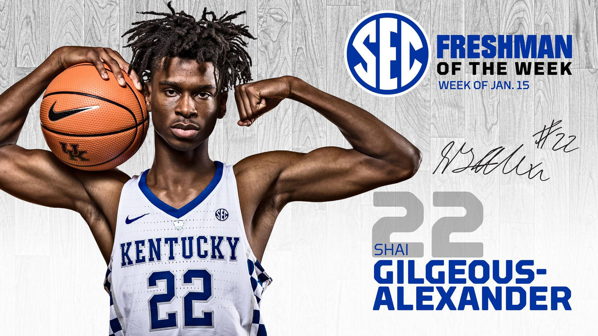 肯塔基籃球運動員Shai Gilgeous-Alexander拿著球展示肌肉，並帶有SEC Freshman of the Week字樣。