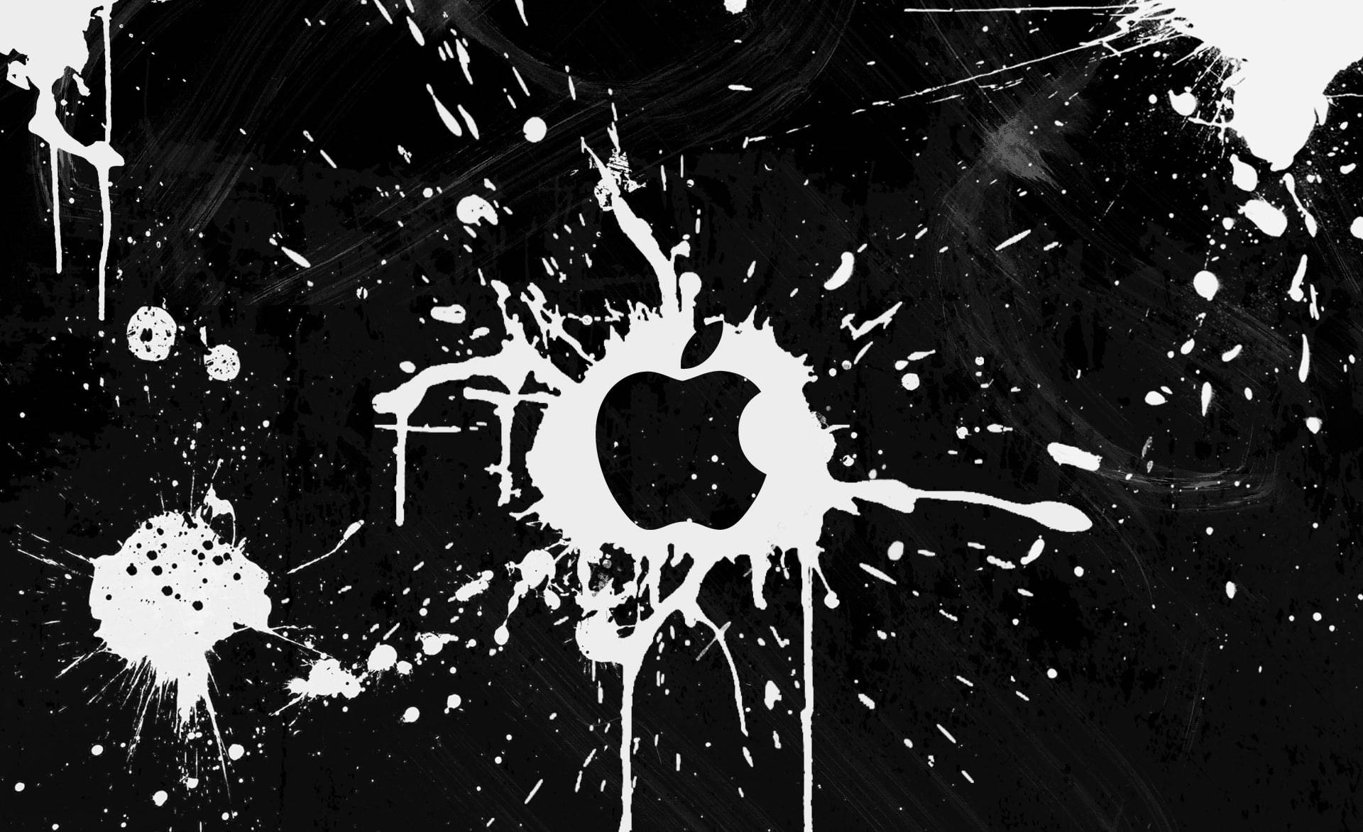 黑色背景上白色油漆濺灑的Apple標誌