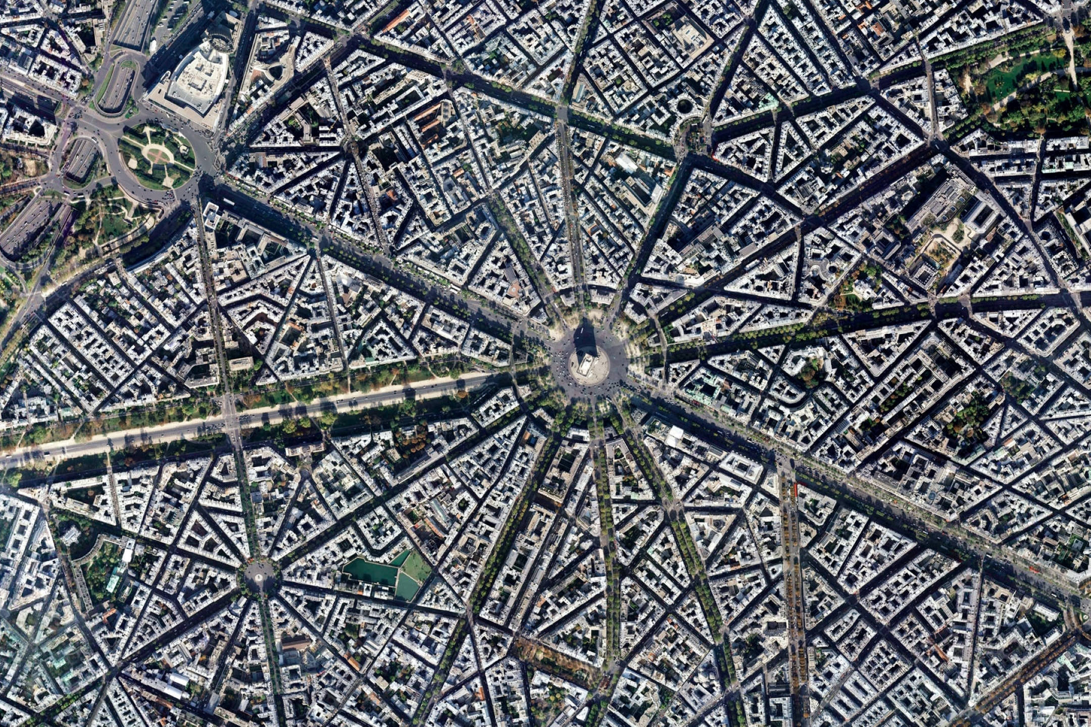 法國巴黎 Google Earth 空拍視角 壁紙 — 從協和廣場向外輻射的巴黎鳥瞰圖，街道和屋頂形成複雜的網格。