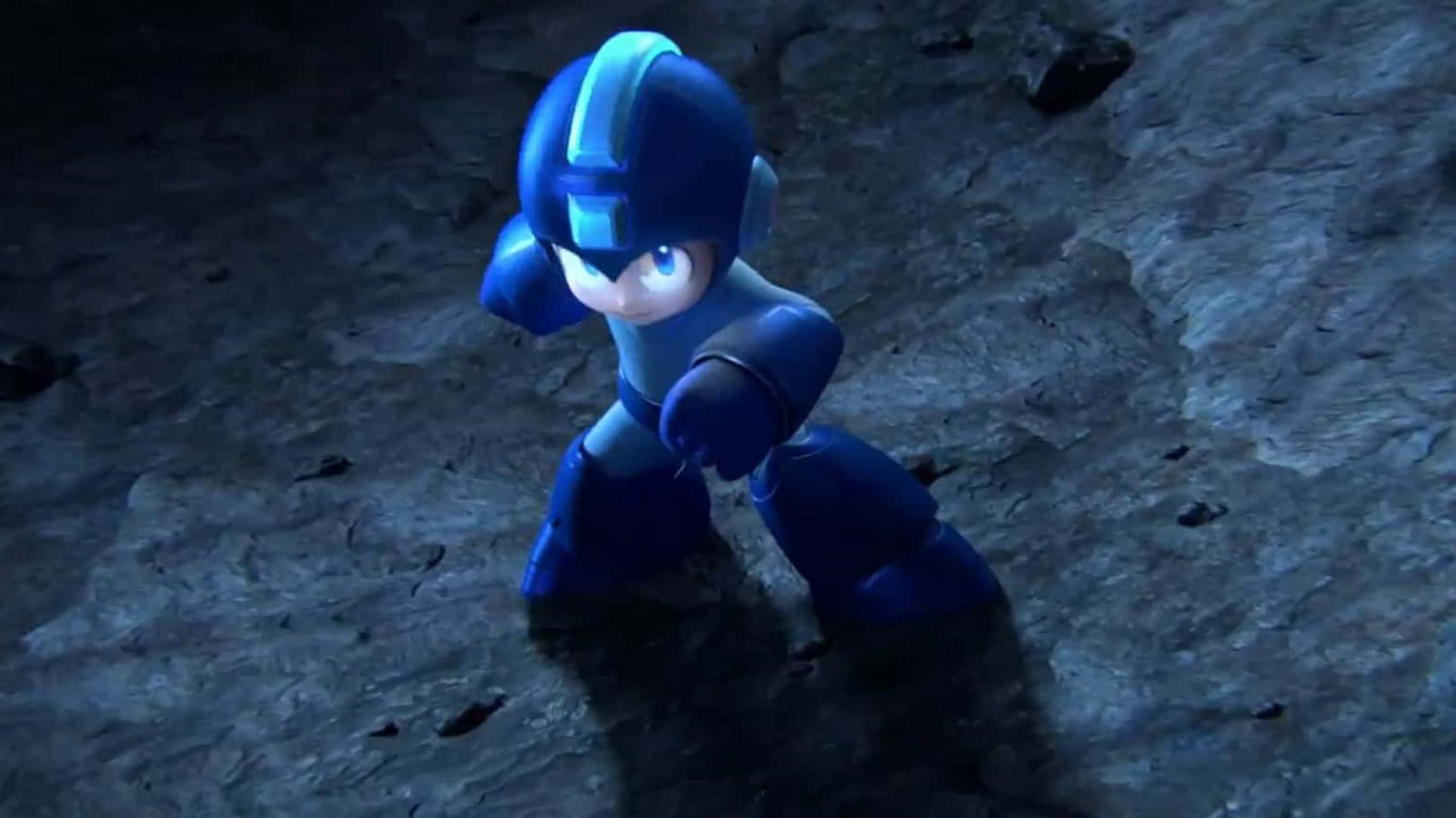 喺黑暗洞穴中雙眼發光嘅藍色裝甲機械人Mega Man。