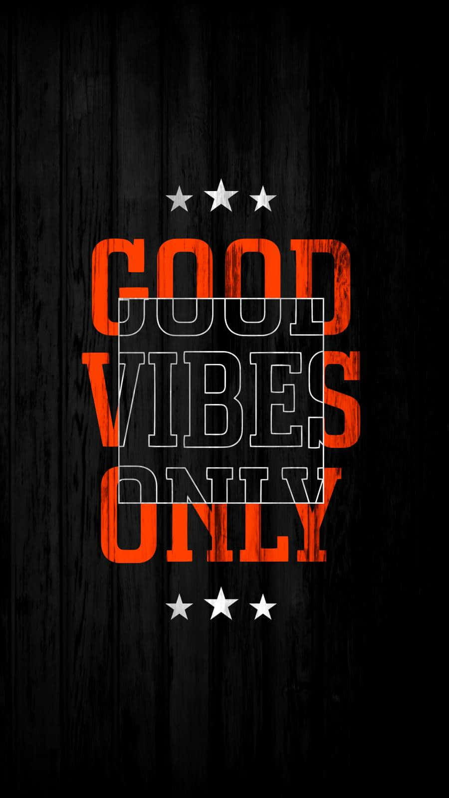 深色木背景上帶白色星星的橙色 good vibes only 文字