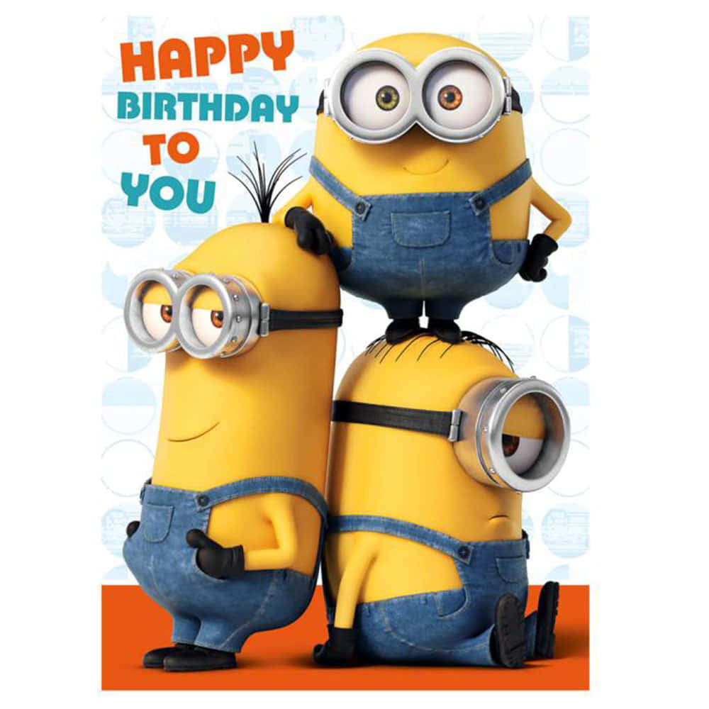 三個穿著工裝褲的Minions以愉快表情慶祝生日。