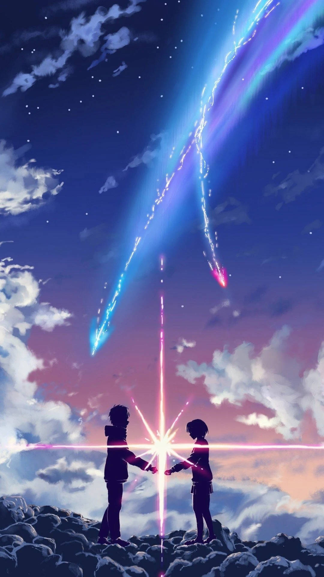 流星劃空手機壁紙 壁紙 — 兩個剪影人物站在岩石懸崖上，在繁星點點的暮色天空下，手牽著手，從他們緊握的手中射出耀眼的光芒。