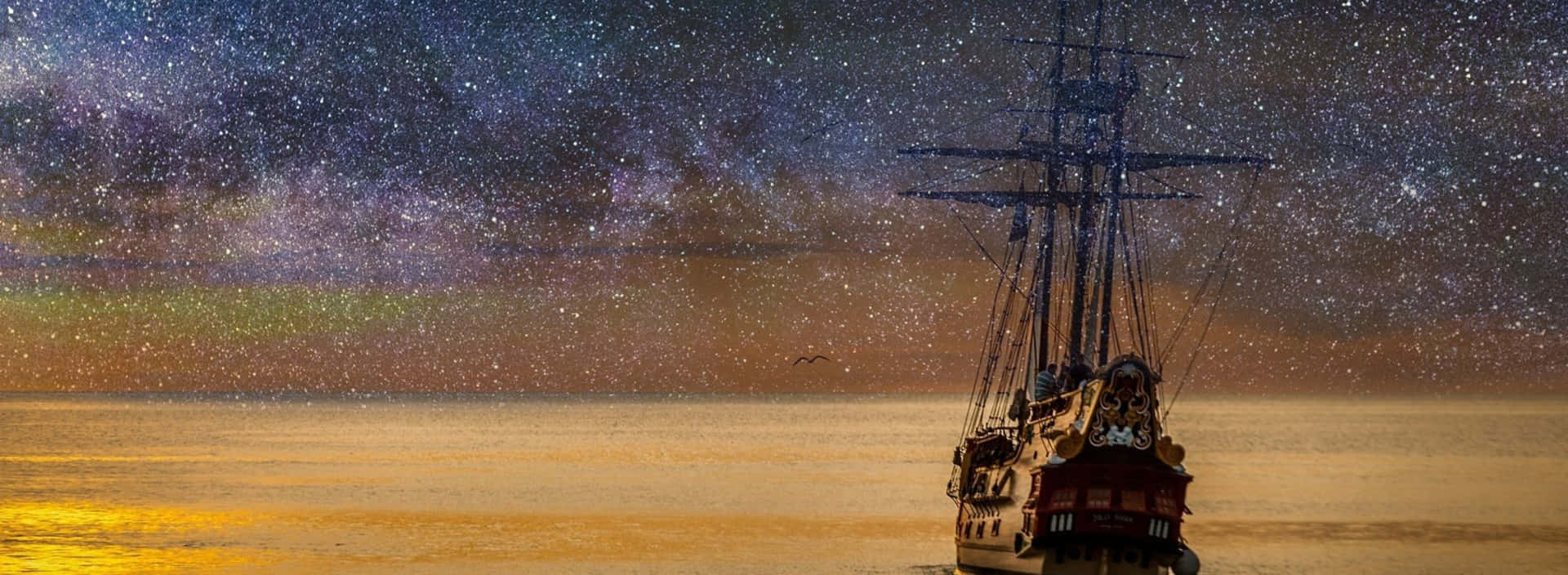 海盜船在星空下航行，銀河在平靜的海面上。