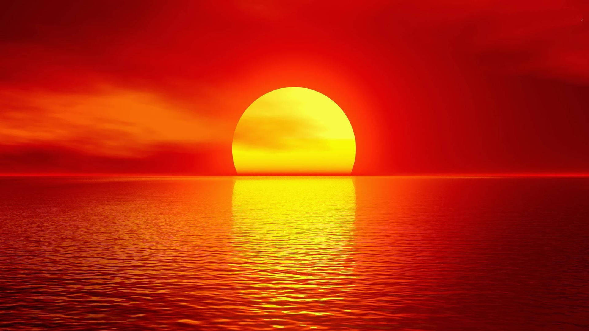 平靜海面上的鮮豔紅色日落，帶有發光的太陽倒影。