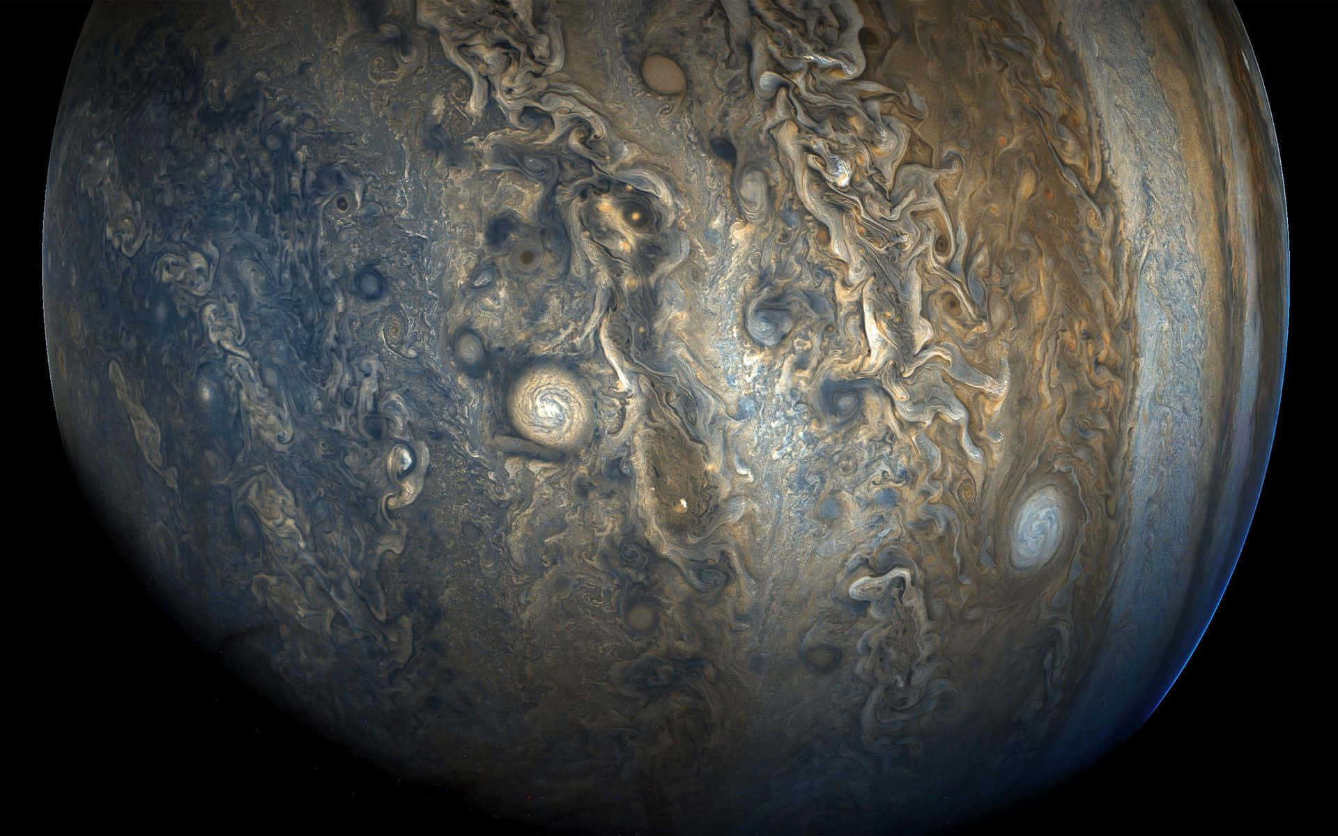 海灘日落剪影燈塔 壁紙 — 木星嘅漩渦風暴同雲帶喺太空嘅漆黑中嘅特寫視圖。