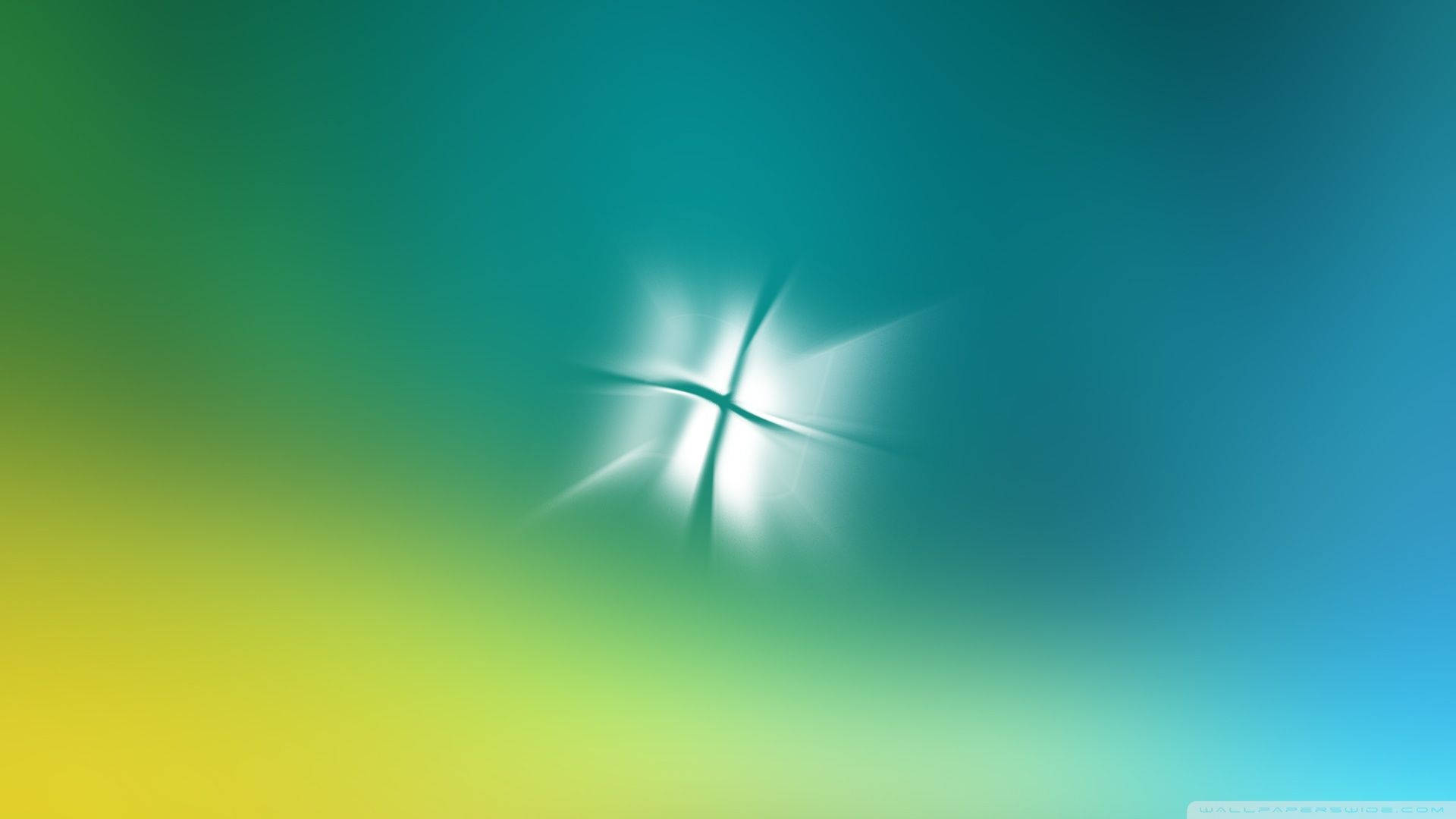 海色 Windows Vista 壁紙 — 發光的白色十字爆裂從中心輻射，背景是從青綠色到黃藍色的平滑漸變。