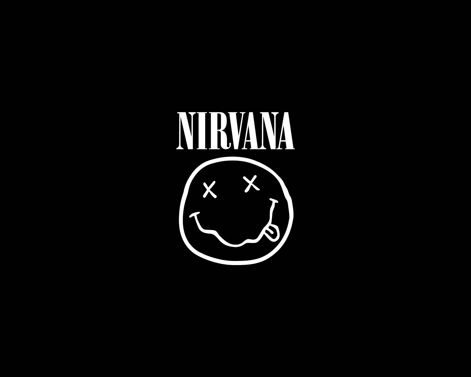 涅槃樂隊4K微笑標誌 壁紙 — 純黑色背景上，粗體白色字母 NIRVANA 位於一個簡單的白色笑臉上方，笑臉有 X 形眼睛和破裂的笑容。