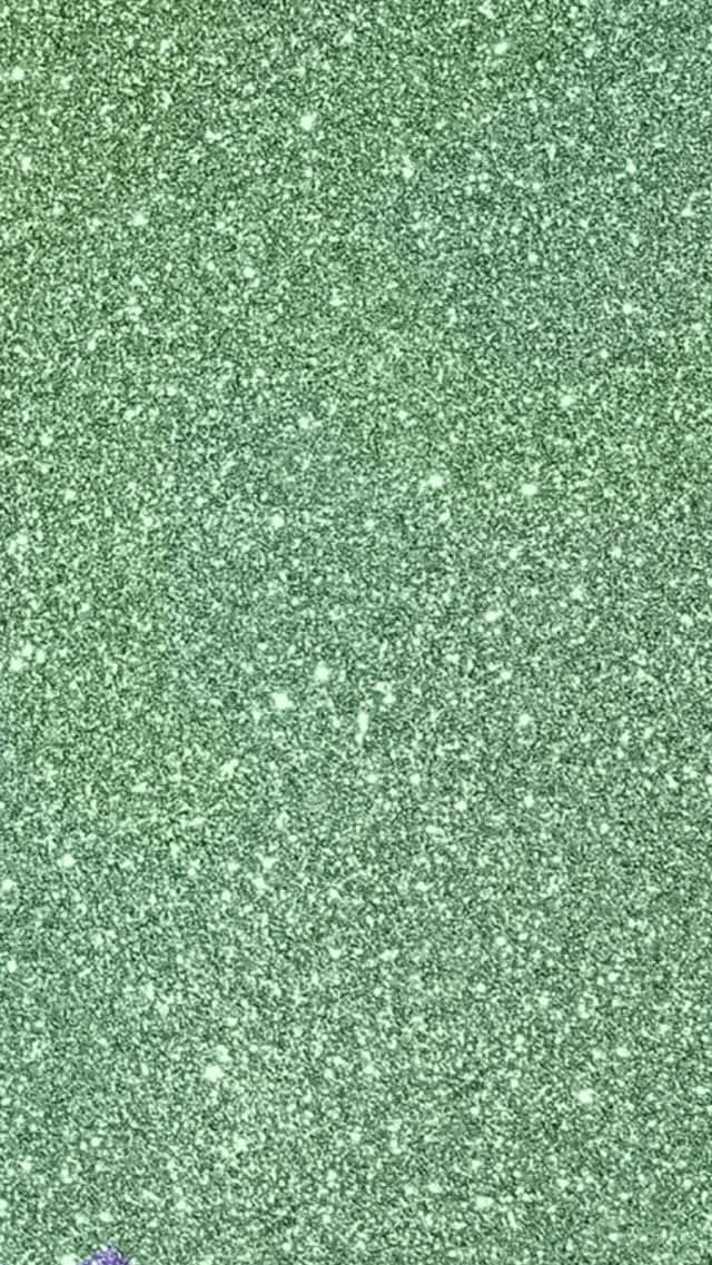 帶有明亮斑點的閃爍綠色亮片紋理