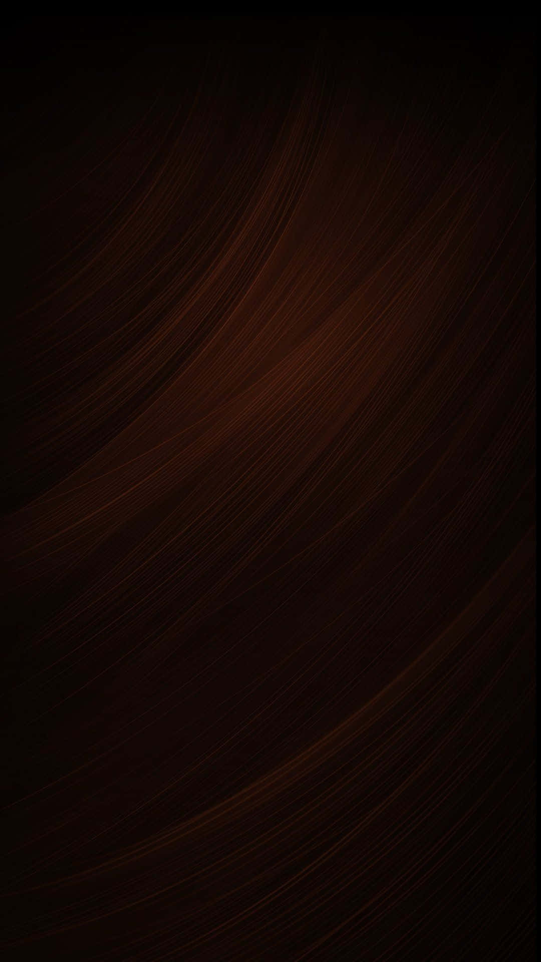 Brown Abstract 桌布 壁紙 — 深棕色抽象背景，帶有流動的暖琥珀色光線斜紋。
