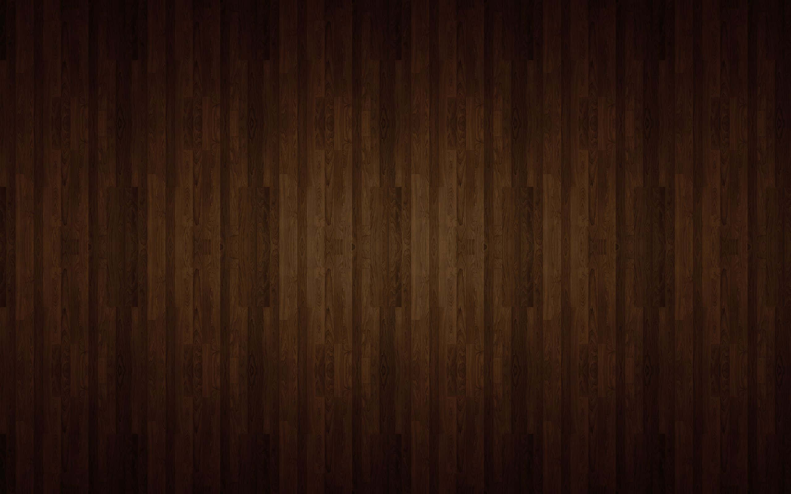 Mahogany 桌布 壁紙 — 深棕色木地板，帶有天然木紋圖案和微妙的燈光漸變。