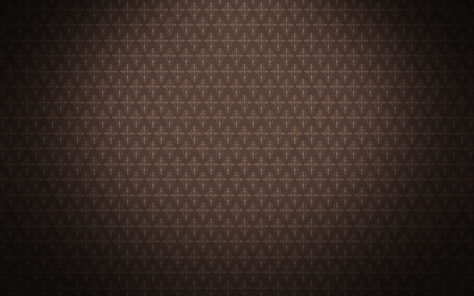 Brown Vintage 桌布 壁紙 — 深棕色牆紙，帶有重複的金色十字形圖案，逐漸淡入陰影邊緣。