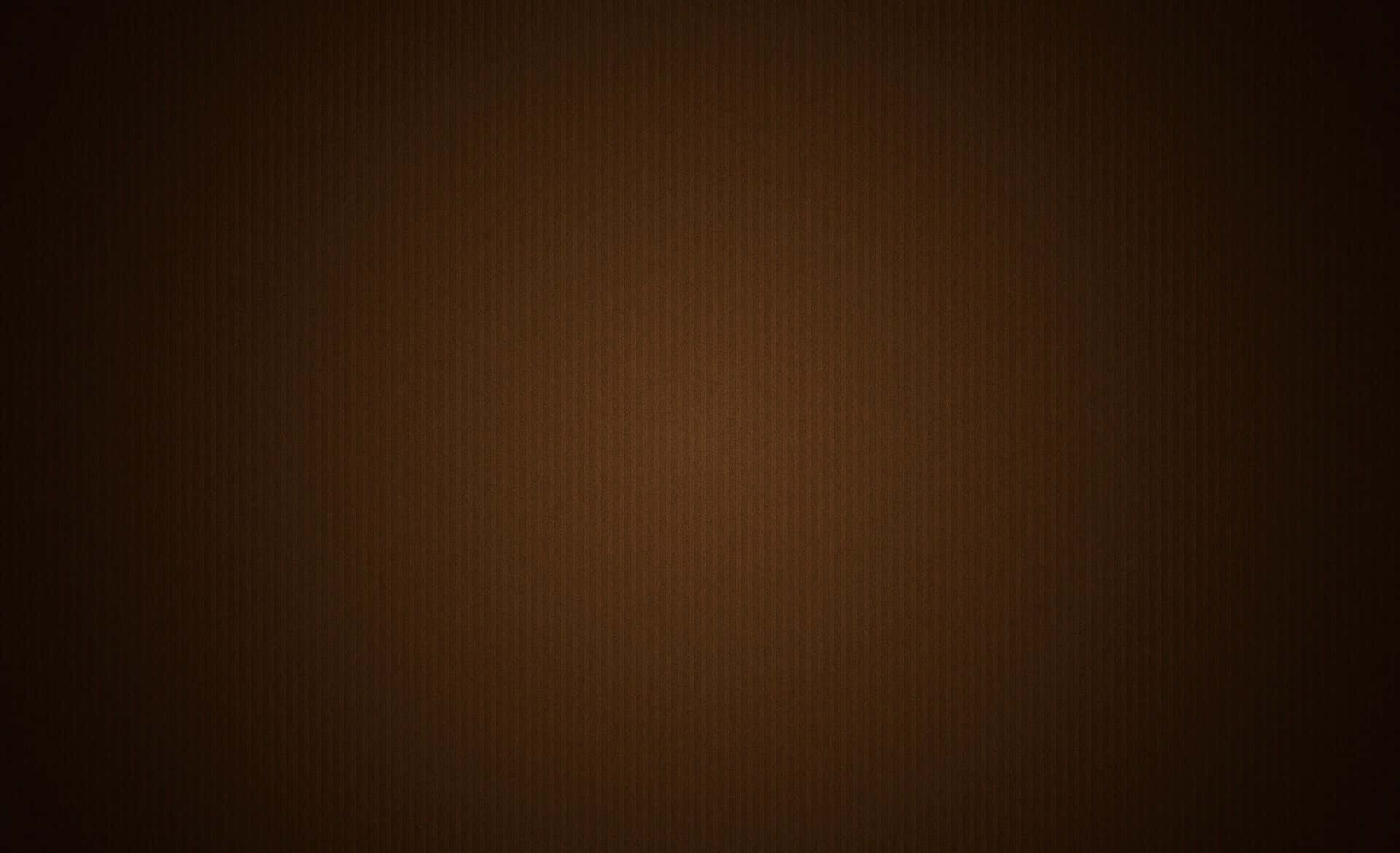 啡色 桌布 壁紙 — 深棕色的平滑漸變，帶有細微紋理，從深色邊緣漸變到溫暖的中心。