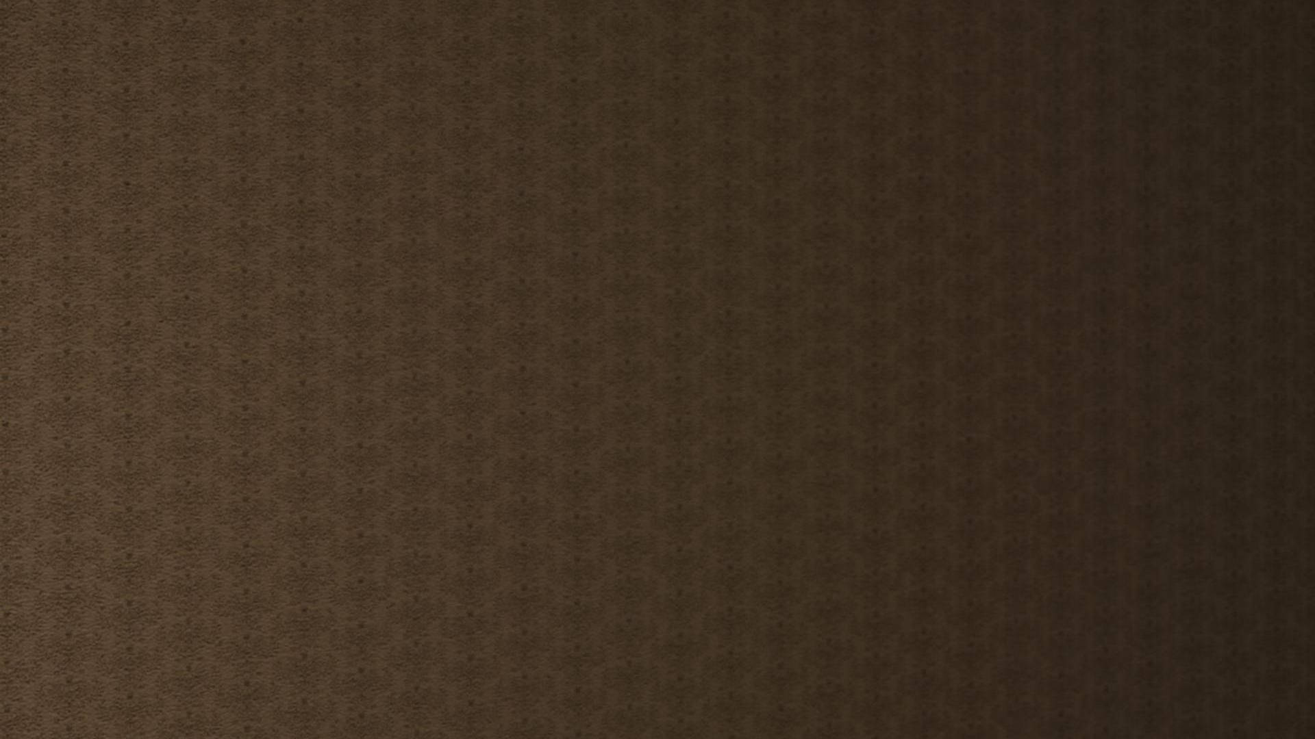 帶有重複幾何圖案的深棕色紋理壁紙。