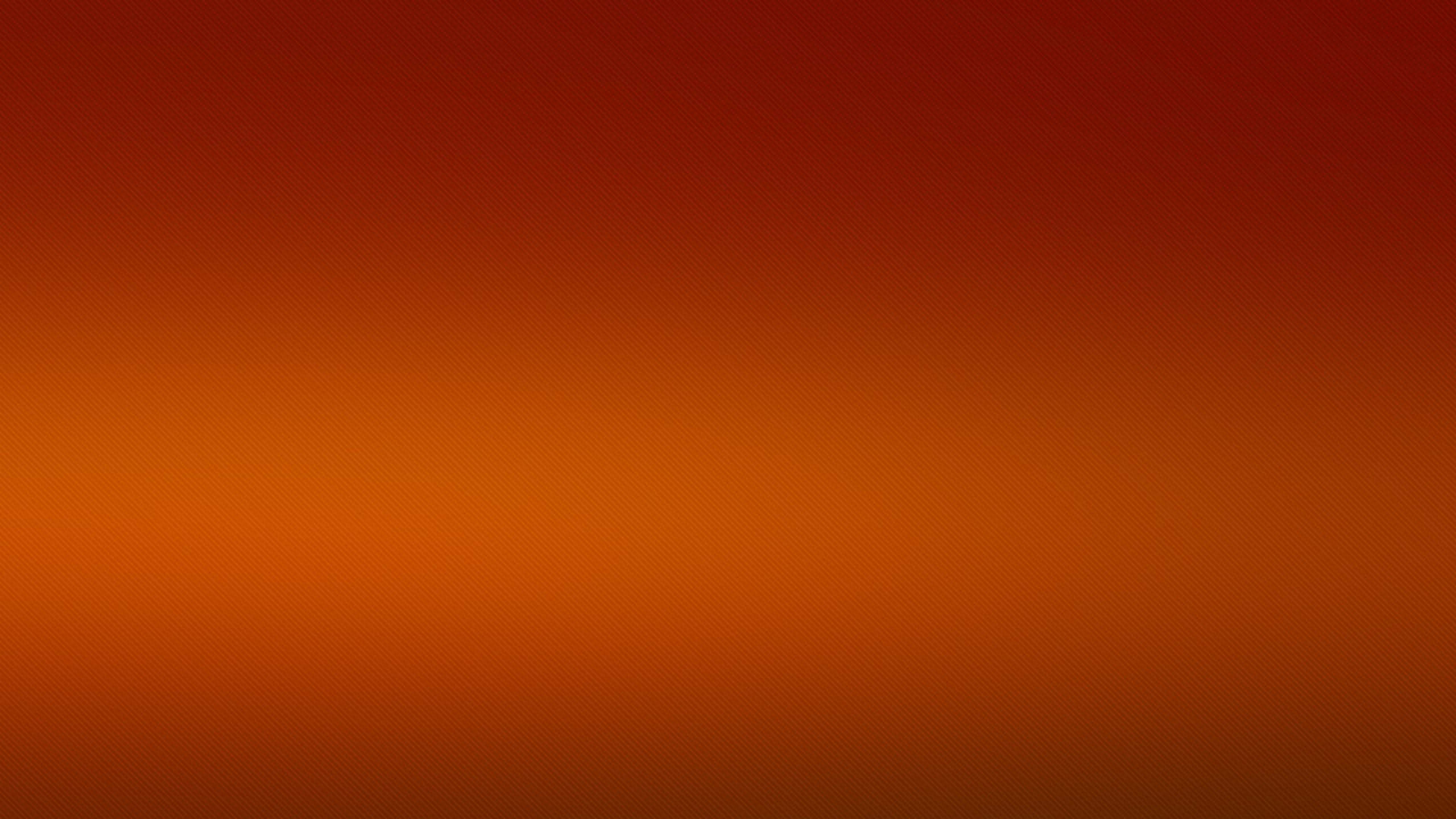 深橙黑光色圖像 壁紙 — 從深紅色到暖橙色的平滑漸變，整個畫面帶有微妙的紋理圖案。