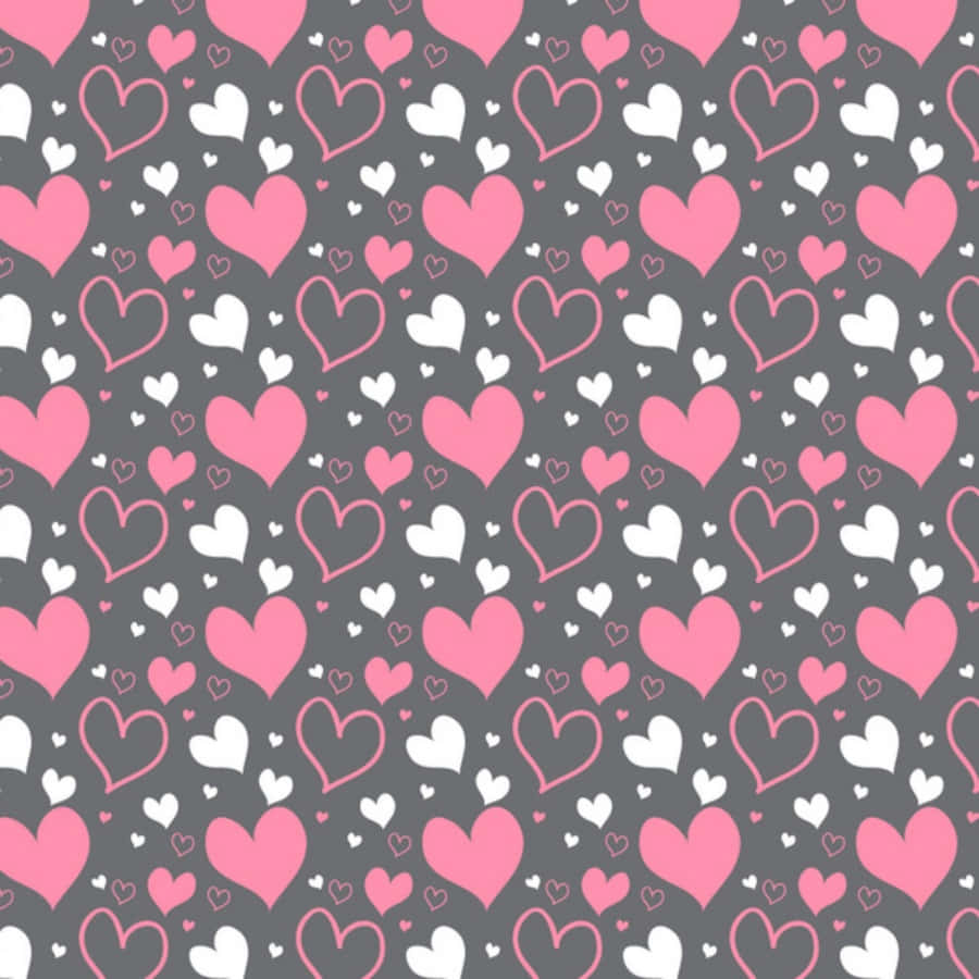 Heart Pattern 桌布 壁紙 — 深灰色背景上重複的粉紅色和白色心形圖案，營造出甜美浪漫的牆紙。