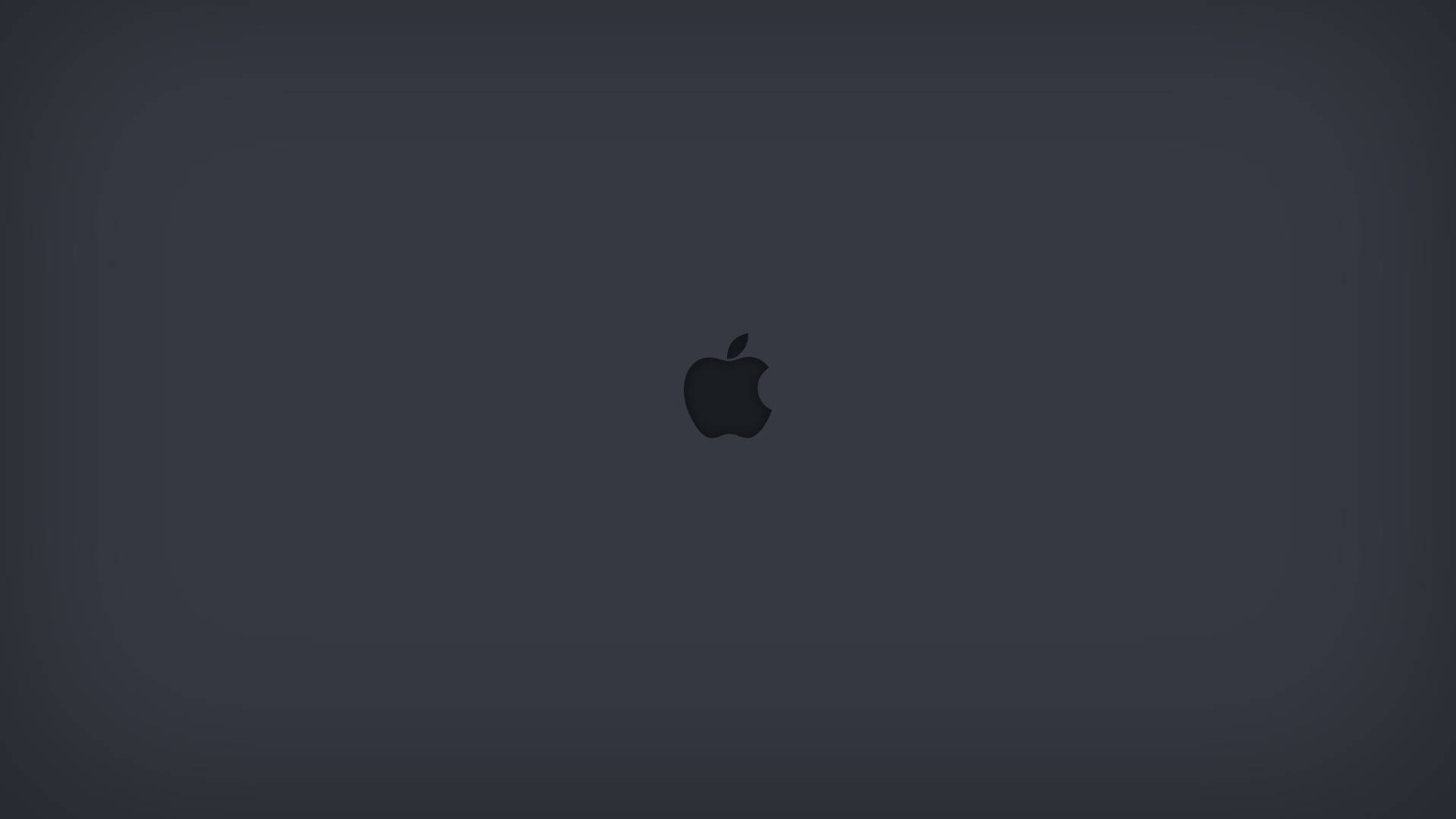 深灰色背景，中央帶有Apple標誌