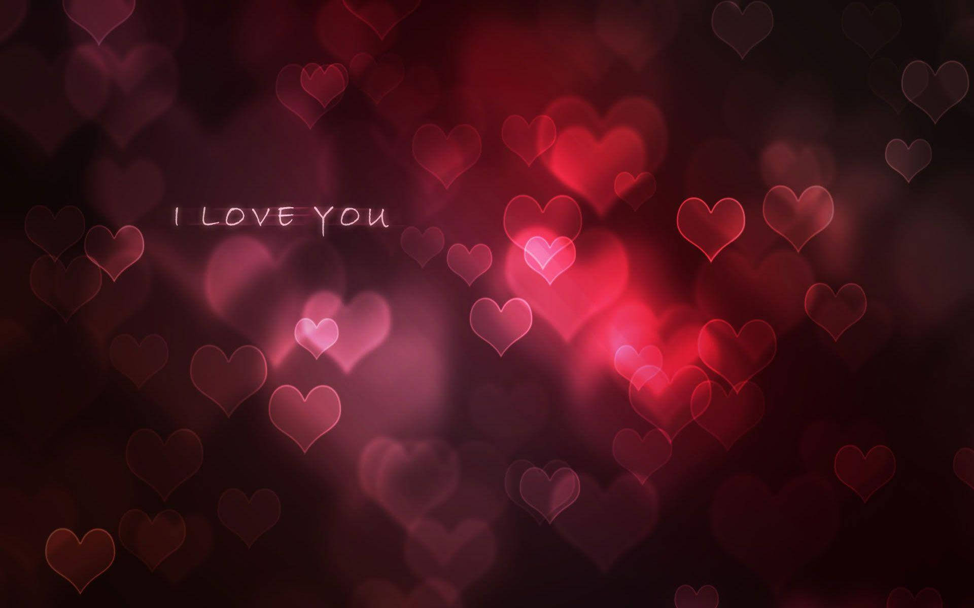 Love Quotes 桌布 壁紙 — 深紅和粉紅色的柔和發光心形在黑暗浪漫背景上圍繞著「I LOVE YOU」文字漂浮。
