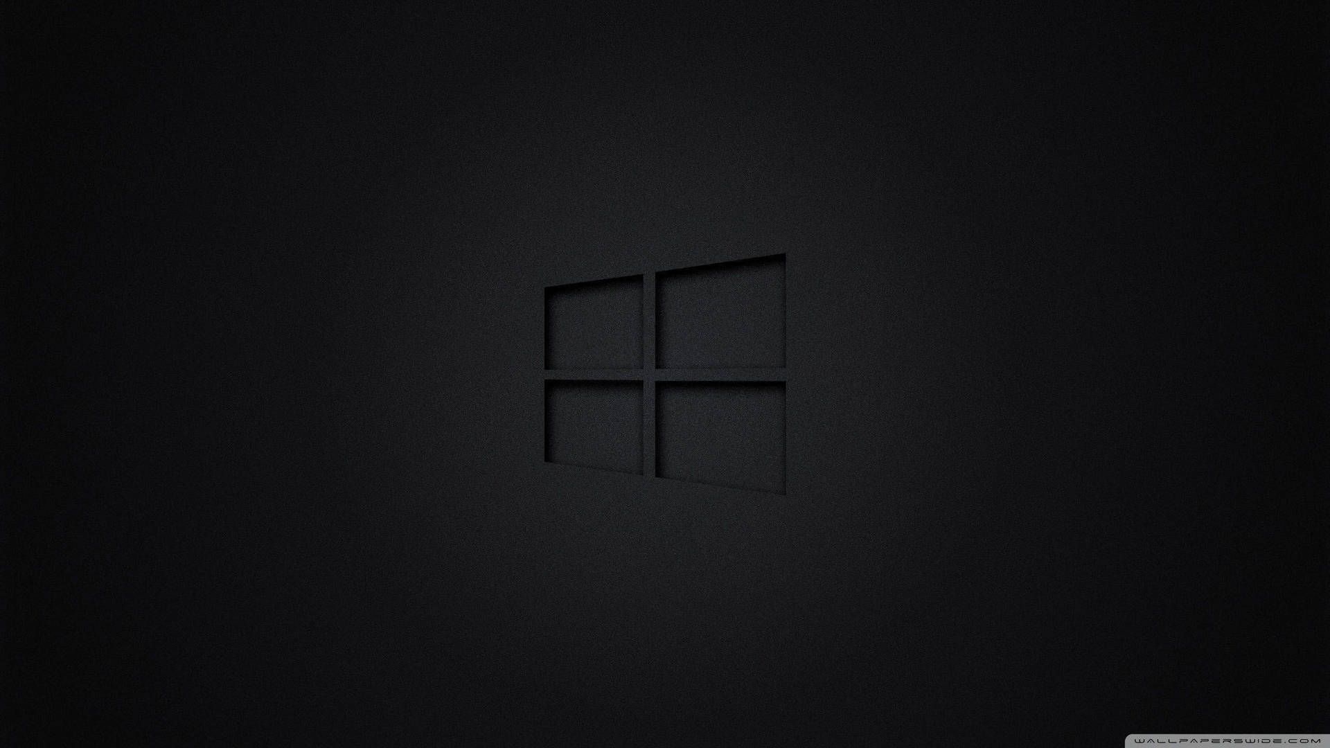 Windows標誌壓印在帶有柔和照明的深色紋理表面上