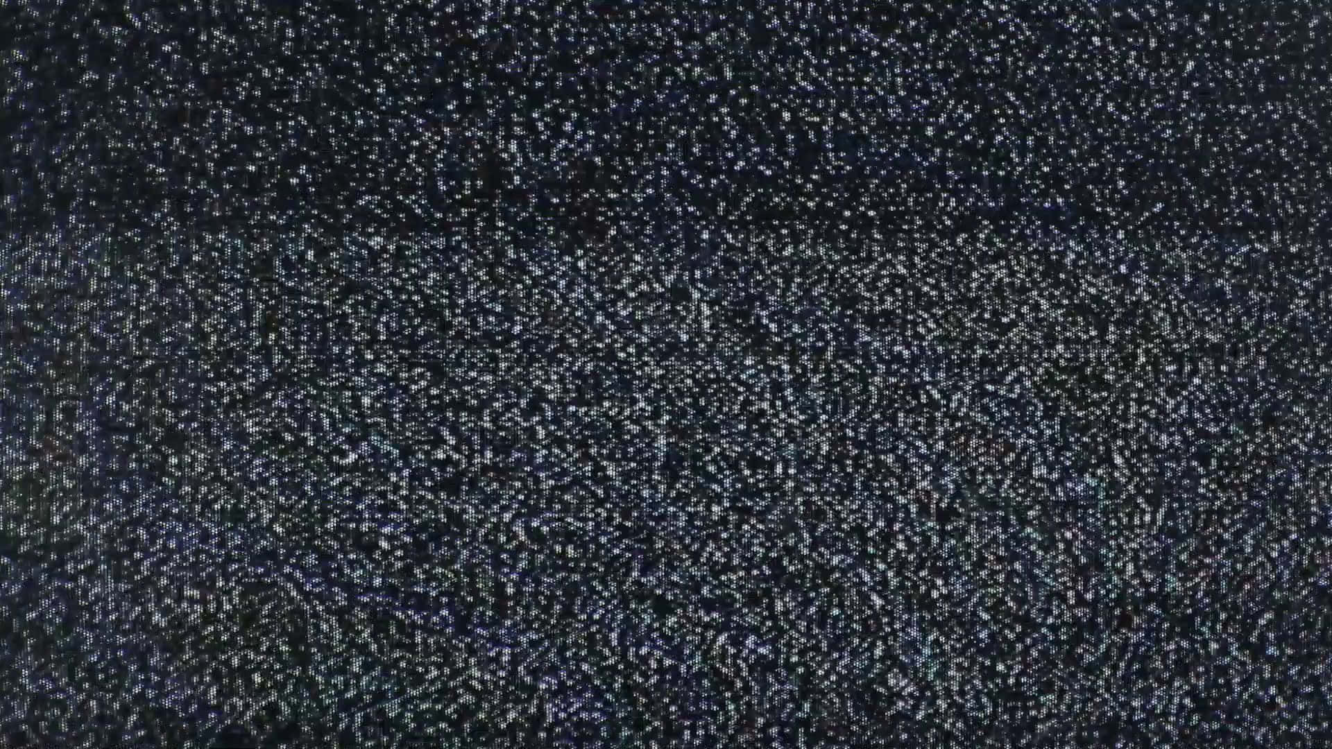 靜態gif 桌布 壁紙 — 深色紋理布料的特寫，帶有散落的閃亮斑點捕捉光線。