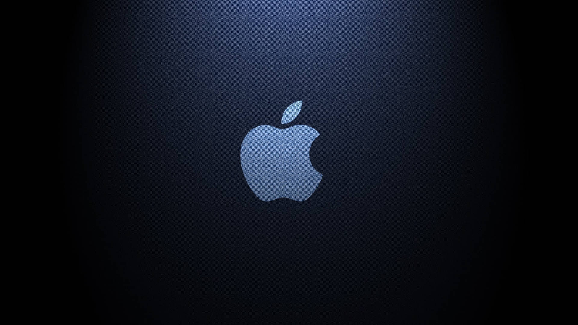 Apple標誌在深藍色紋理背景上被照亮。