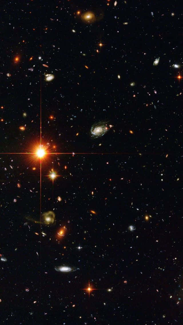 Quasar 桌布 壁紙 — 深邃太空景觀，充滿無數星系和明亮星星，映襯著黑暗的宇宙背景。