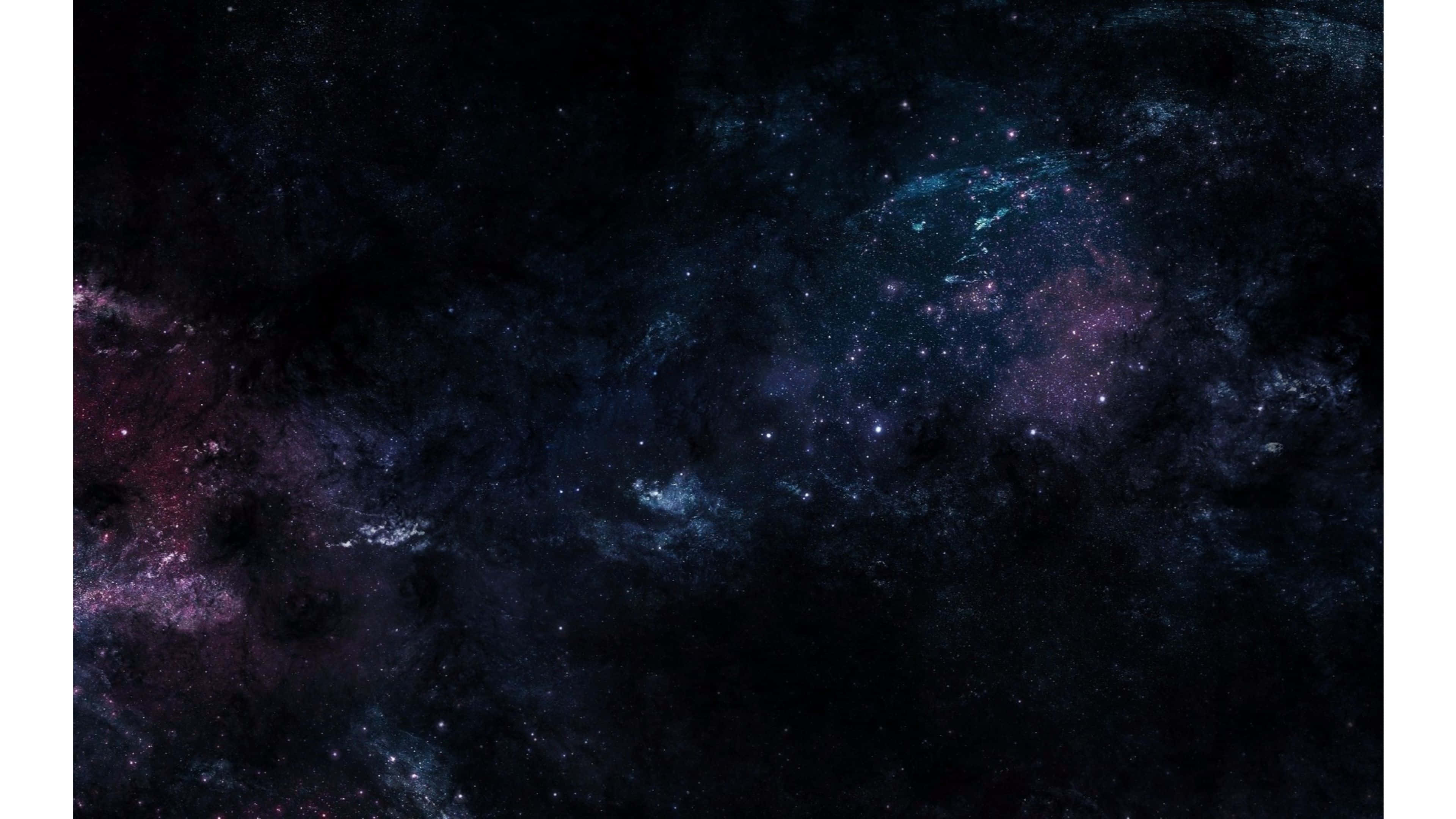 深邃星空 AMOLED 桌面 壁紙 — 宇宙星雲在深空星場中旋轉，呈現深藍、紫和紅色。