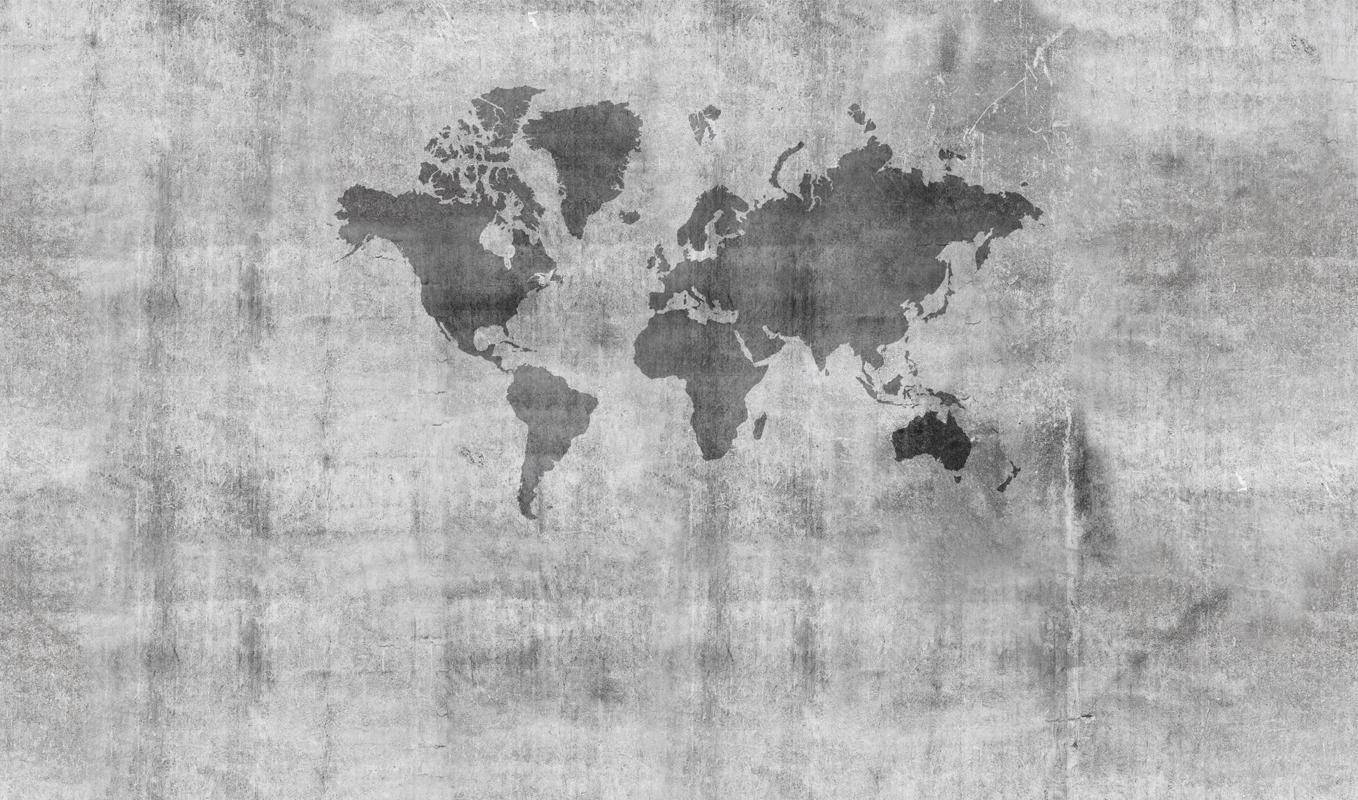 世界地圖輪廓在帶有裂縫和頹廢效果的紋理混凝土牆上。