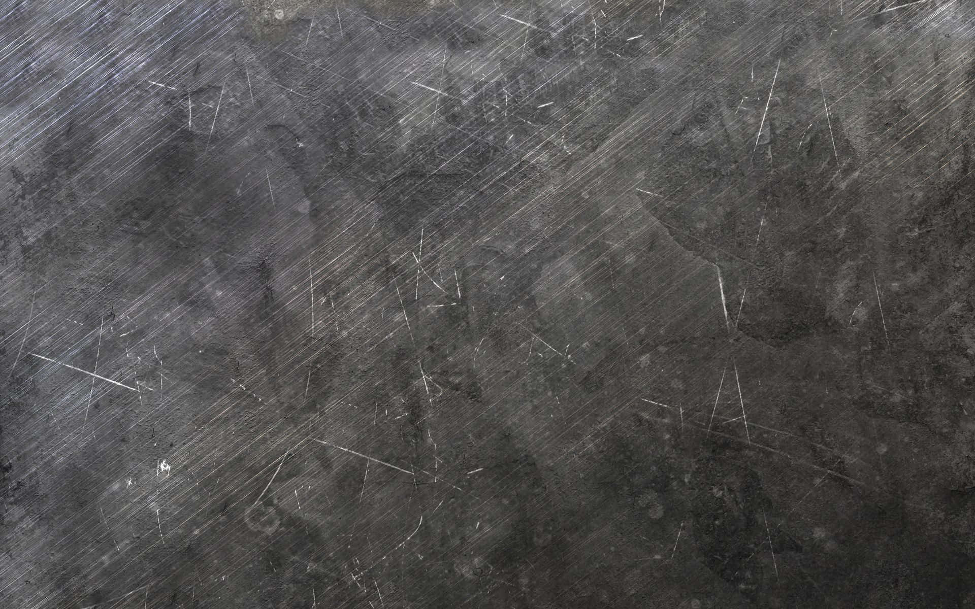 淺灰色刮痕鋼鐵金屬紋理圖 壁紙 — 深灰色金屬表面的特寫，上面佈滿對角線刮痕和磨損痕跡。