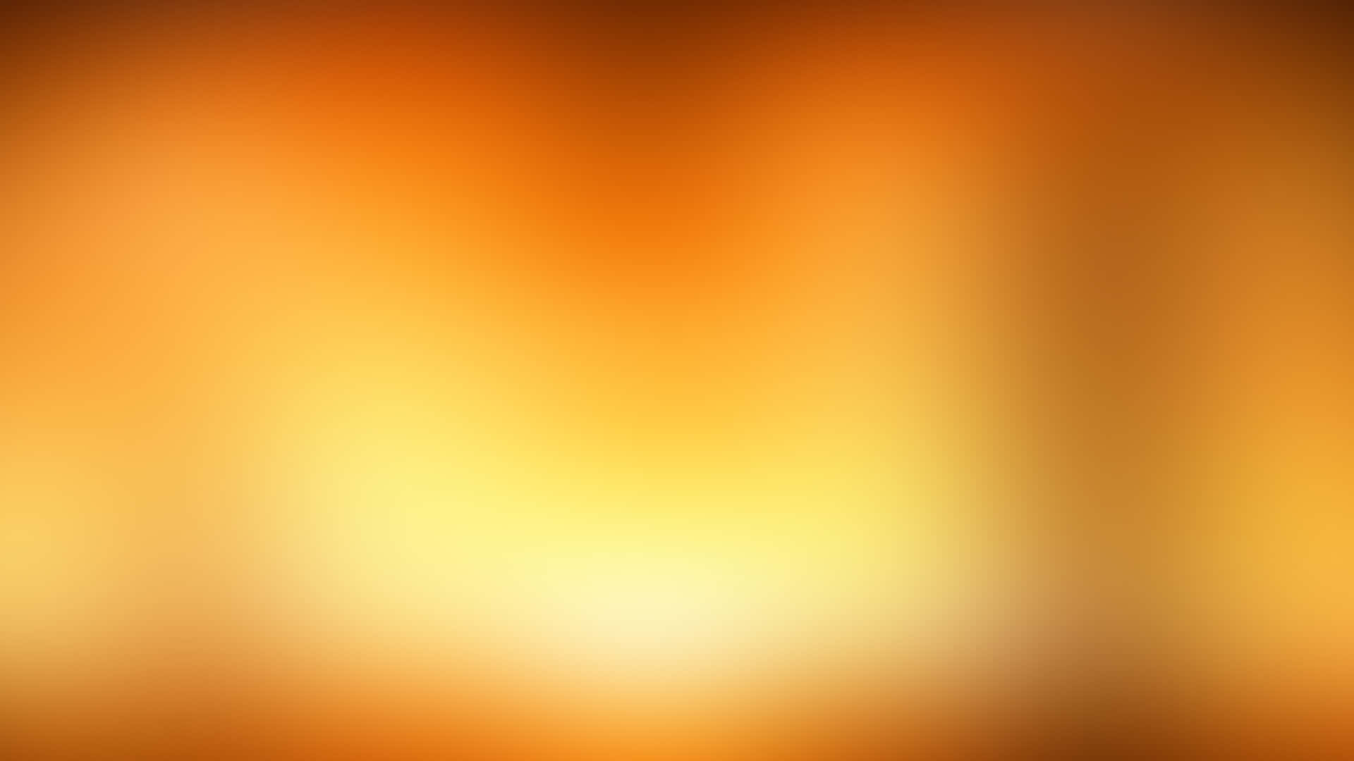 淺色橙黑模糊圖案 壁紙 — 溫暖橙色和黃色的柔和漸變，融合成一個發光的中心。