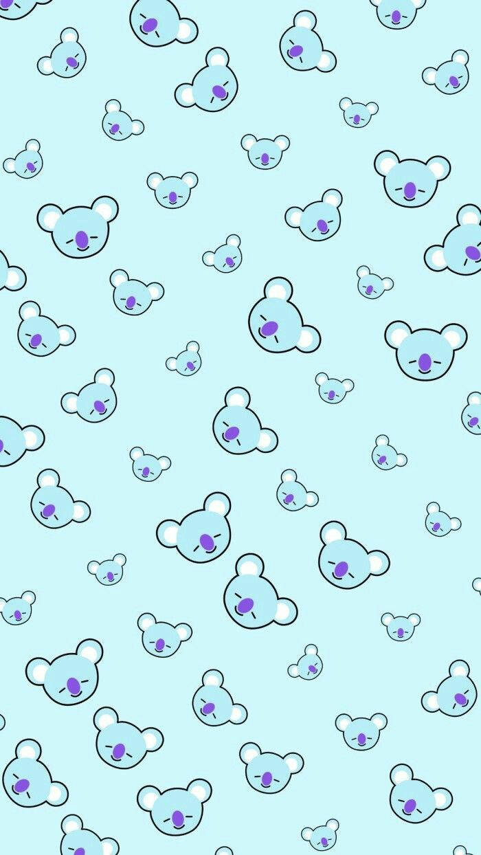 BT21 桌布 壁紙 — 淺藍色牆紙，充滿可愛卡通樹熊面孔，大小和表情各異。