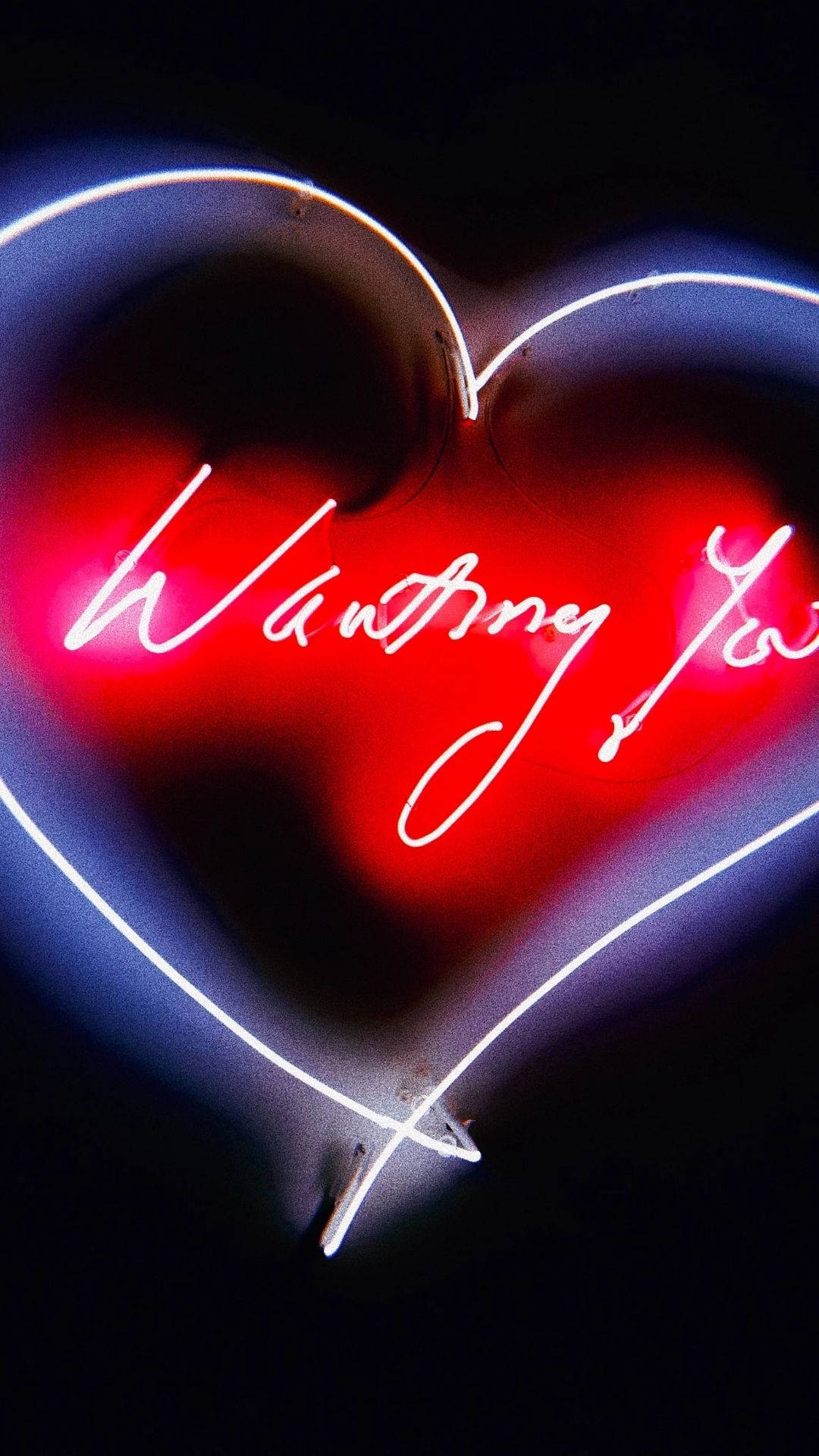 霓虹心形標誌，以紅白燈光顯示「Wanting You」。