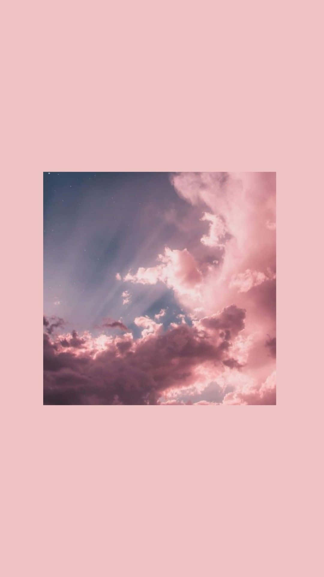 湛藍天空與蓬鬆白雲 壁紙 — 柔軟嘅粉紅色雲朵喺被實心粉紅色邊框框住嘅粉彩天空背景下發出光芒。