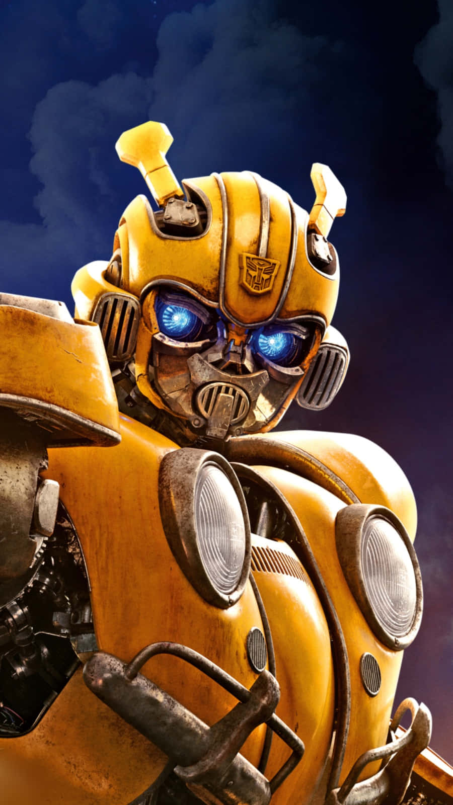 黃色機械人Bumblebee，藍色發光眼睛，擺出戲劇性姿勢。