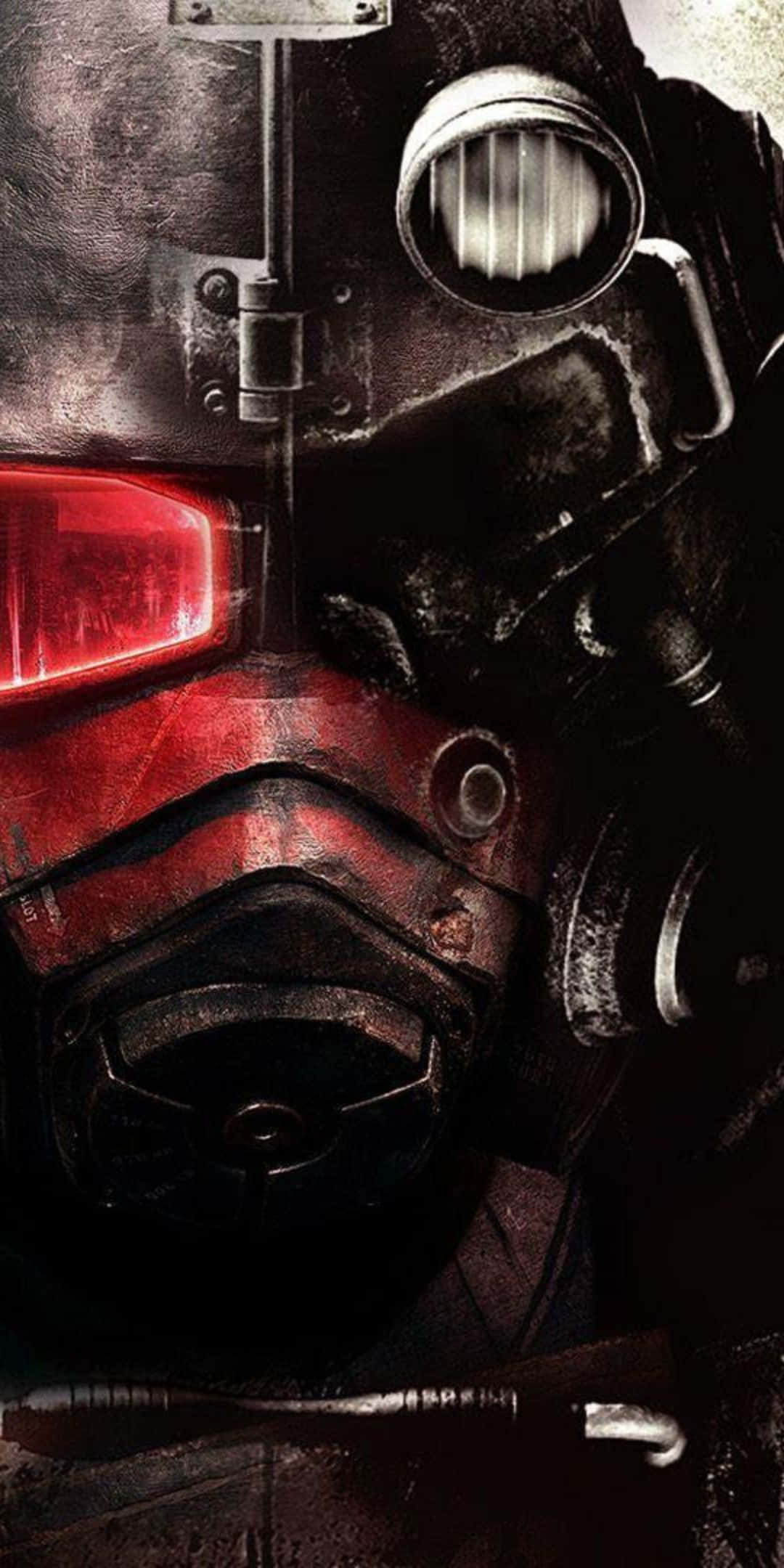 準備在 Pixel 3 上玩 Fallout 76 壁紙 — 近距離拍攝一個風化的末日後防毒面具，帶有發光的紅色眼睛和金屬細節。