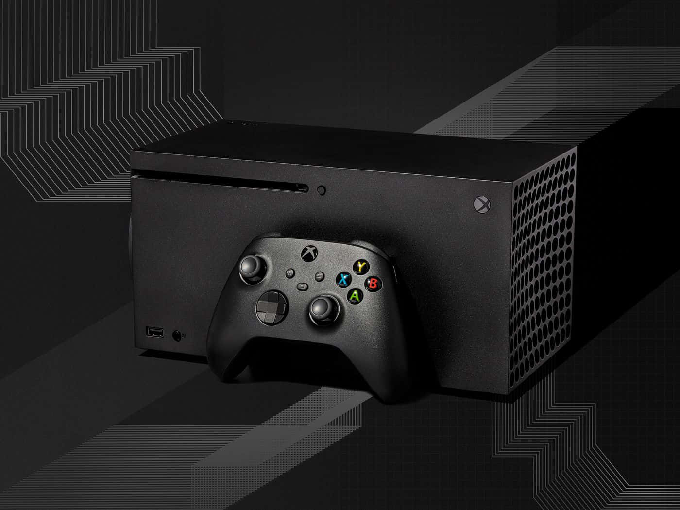 黑色 Xbox 主機和控制器，背景為幾何線條藝術。