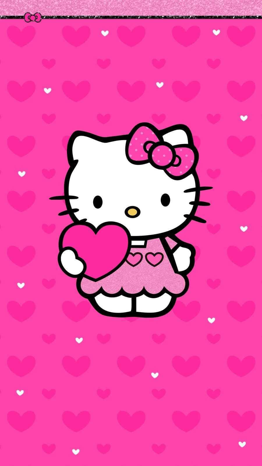 Hello Kitty 在粉紅色心形背景上拿著一顆心。