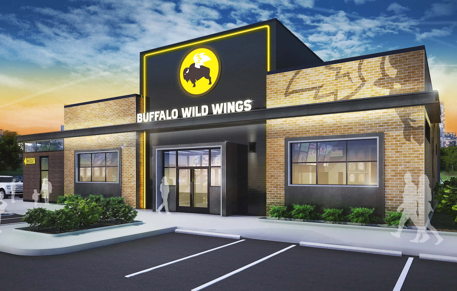 Buffalo Wild Wings餐廳在日落時分的外觀，帶有發光的招牌和空蕩蕩的停車場。