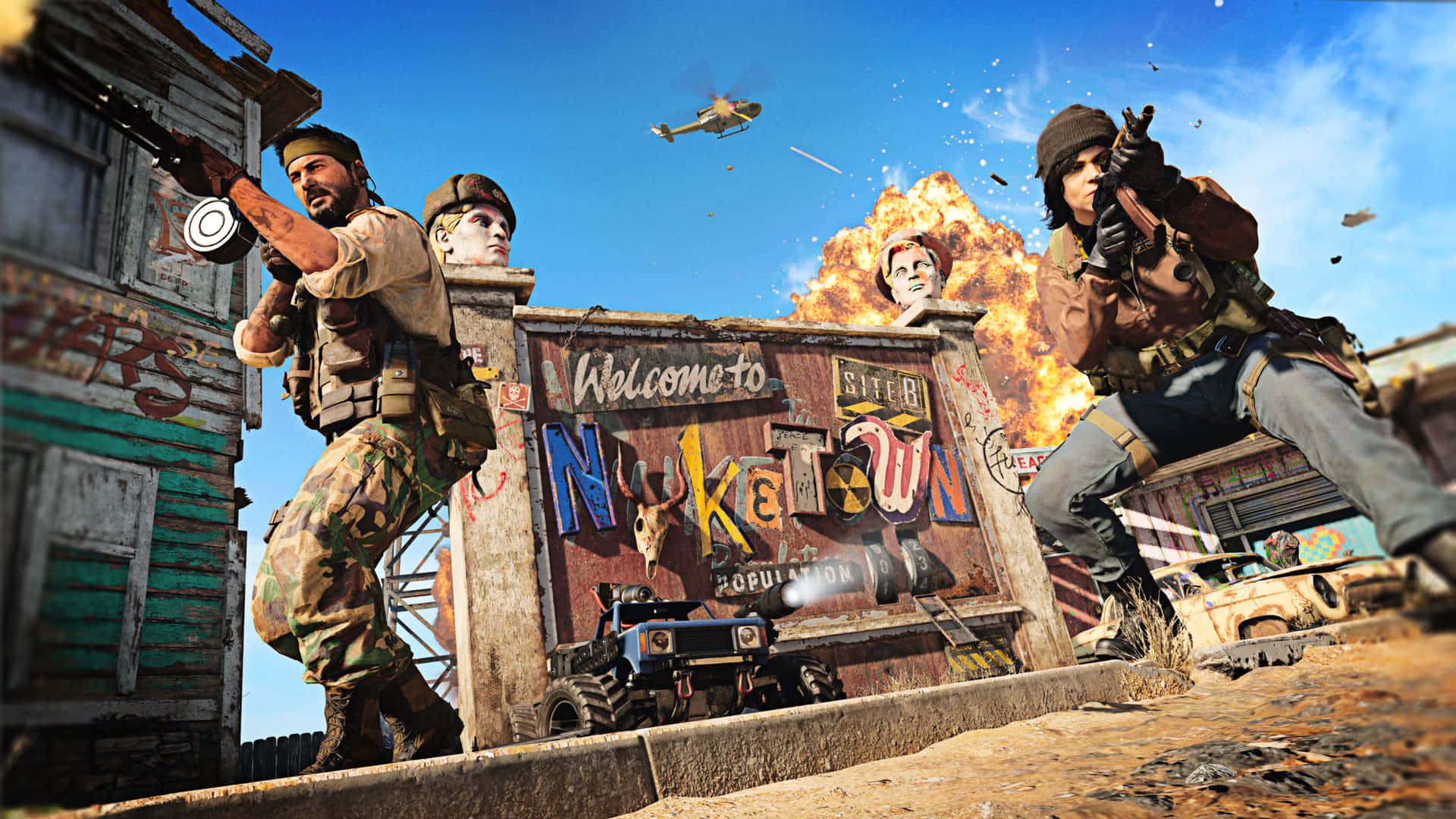準備迎接《決勝時刻 2020》 壁紙 — 士兵在混亂的末日後小鎮中，在「Welcome to Nuketown」標誌附近爆炸中開火。