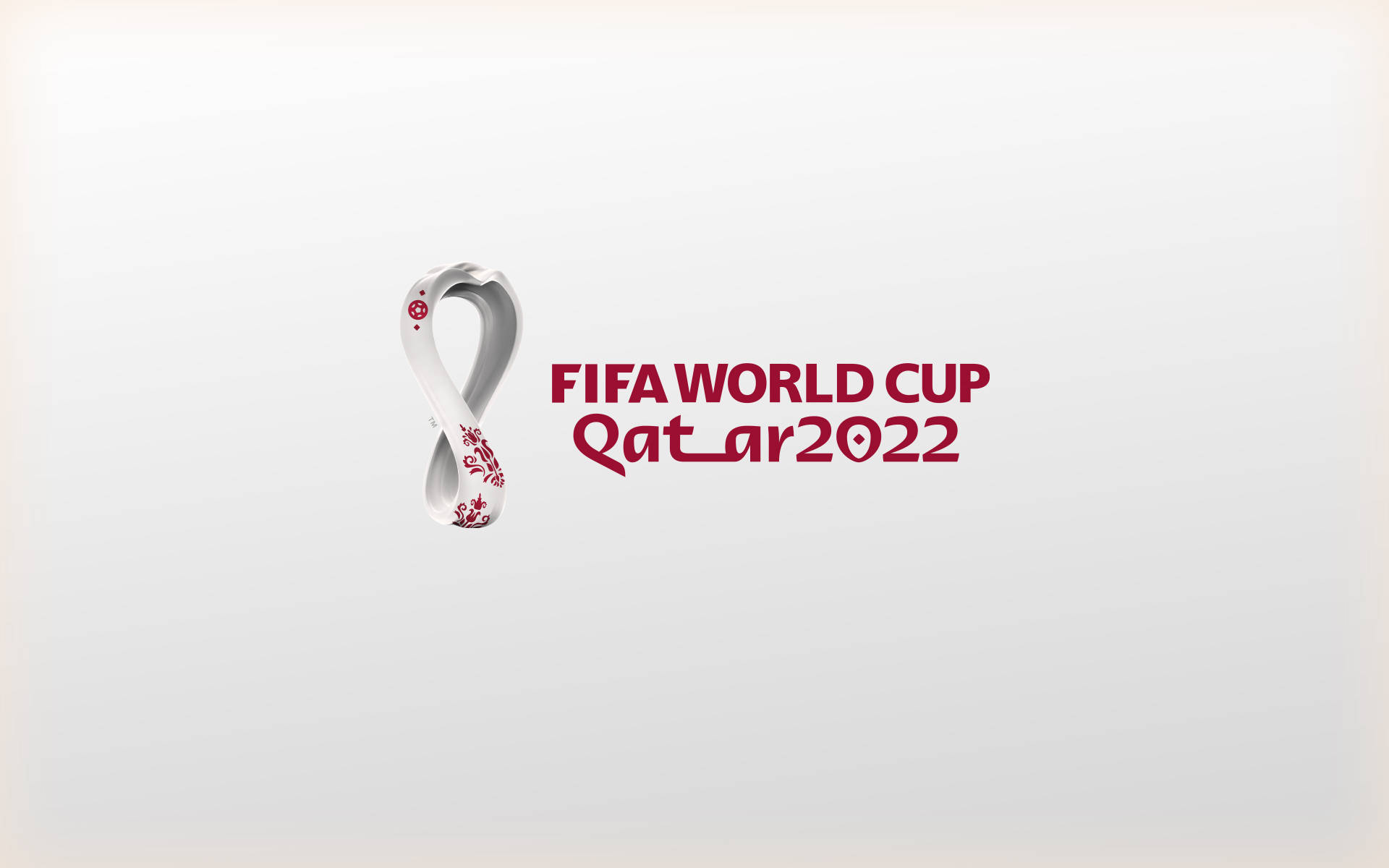 FIFA世界盃卡塔爾2022官方標誌，帶有無限符號和紅色文字。