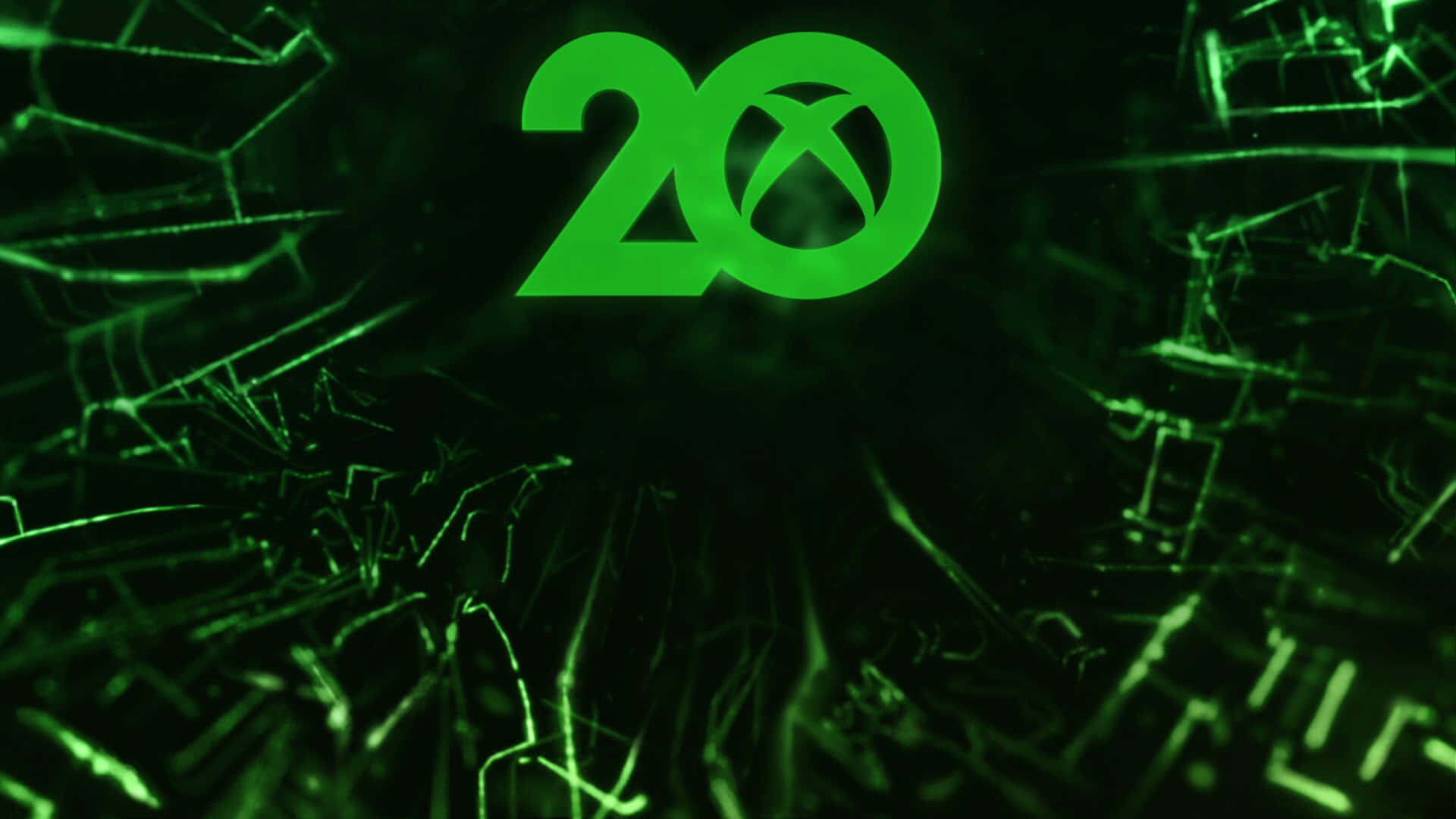 發光綠色Xbox 20標誌在裂紋玻璃背景上