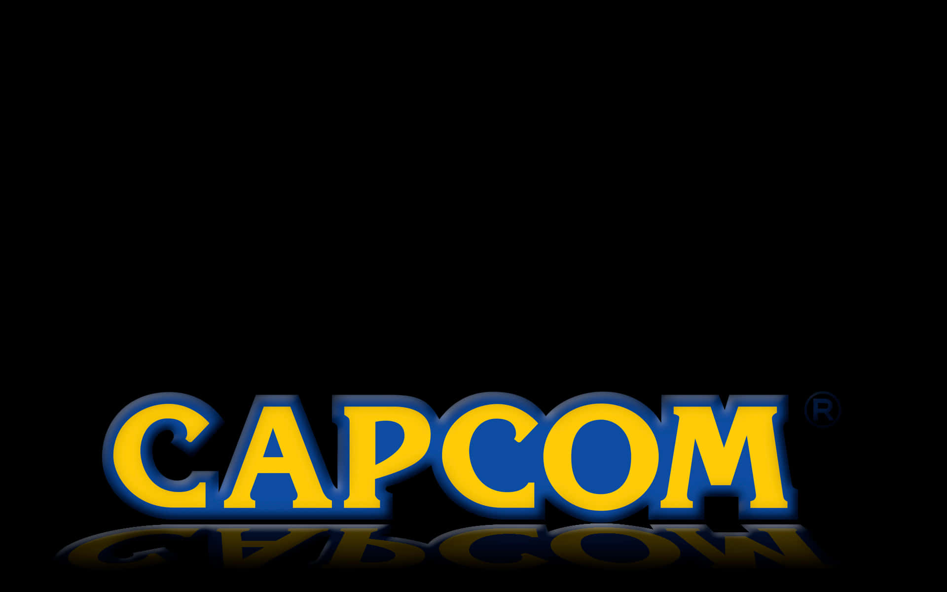 準備迎接卡普空的遊戲冒險 壁紙 — 大膽的黃色和藍色 Capcom 標誌，在純黑色背景上帶有微妙的倒影。
