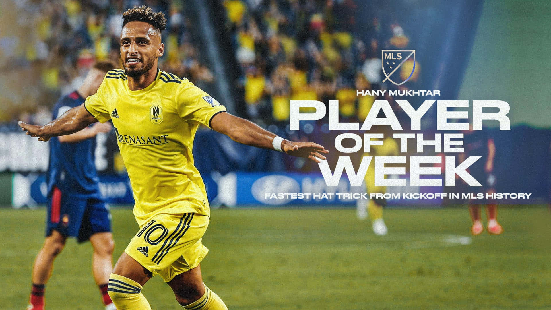漢尼·穆克塔爾 MLS 週度最佳球員海報 壁紙 — 一名身穿黃色球衣的足球員在球場燈光下，於綠色草地上勝利慶祝，背景有球迷。