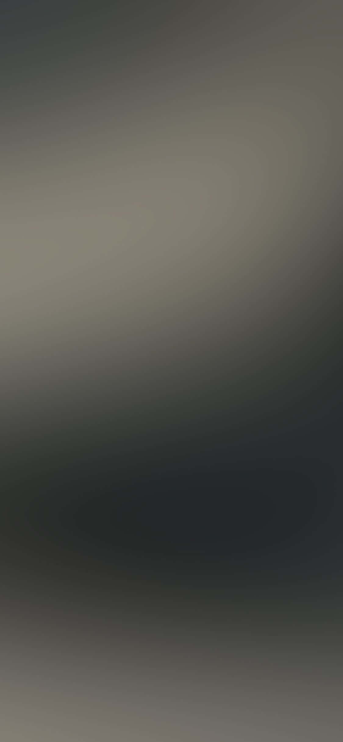 漸層淺黃與深灰背景 壁紙 — 極簡漸變壁紙，從深灰色過渡到淺灰色，帶有柔和模糊的漩渦。