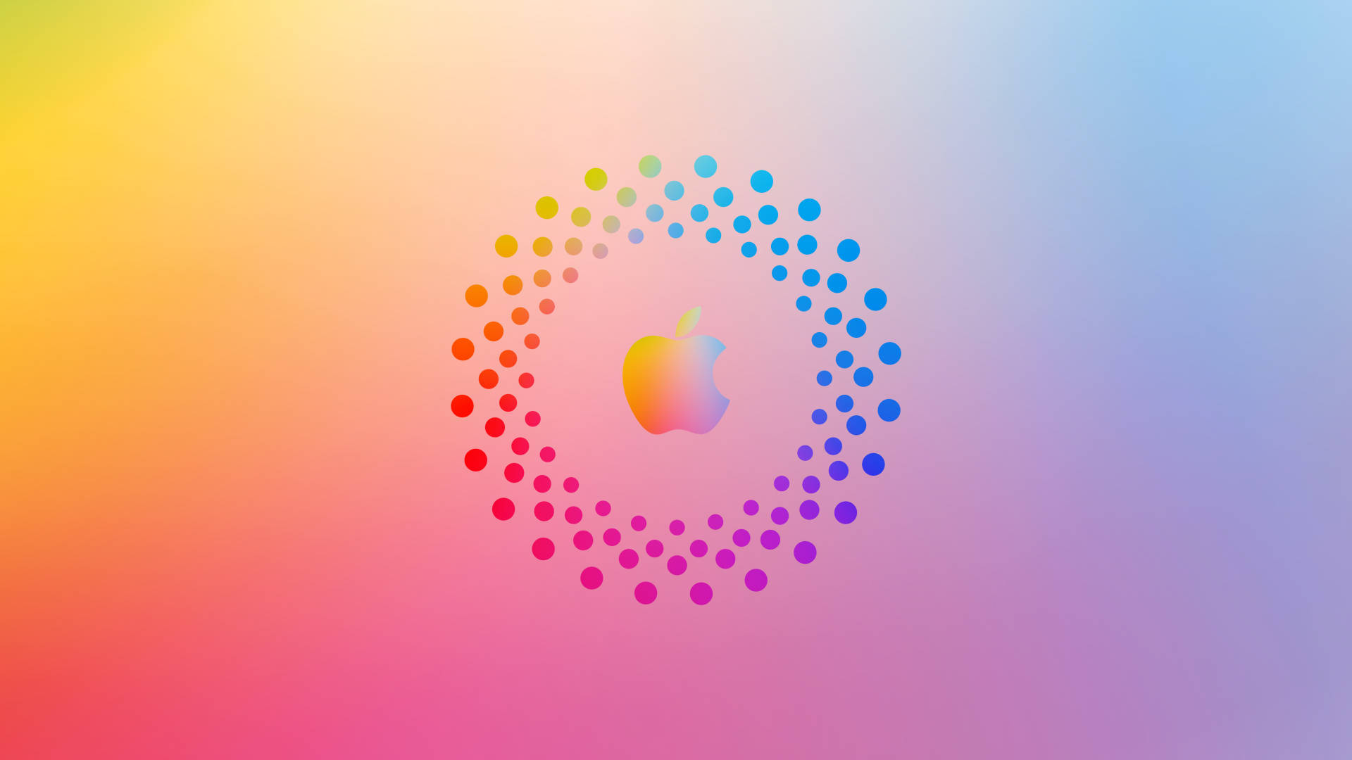 Apple標誌被彩色圓點環圍繞在漸變背景上